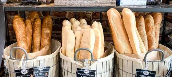 Artisan French baguettes in rustic baskets