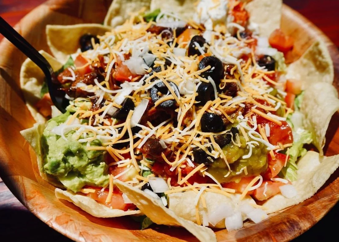 Colorful taco salad in a crispy tortilla bowl