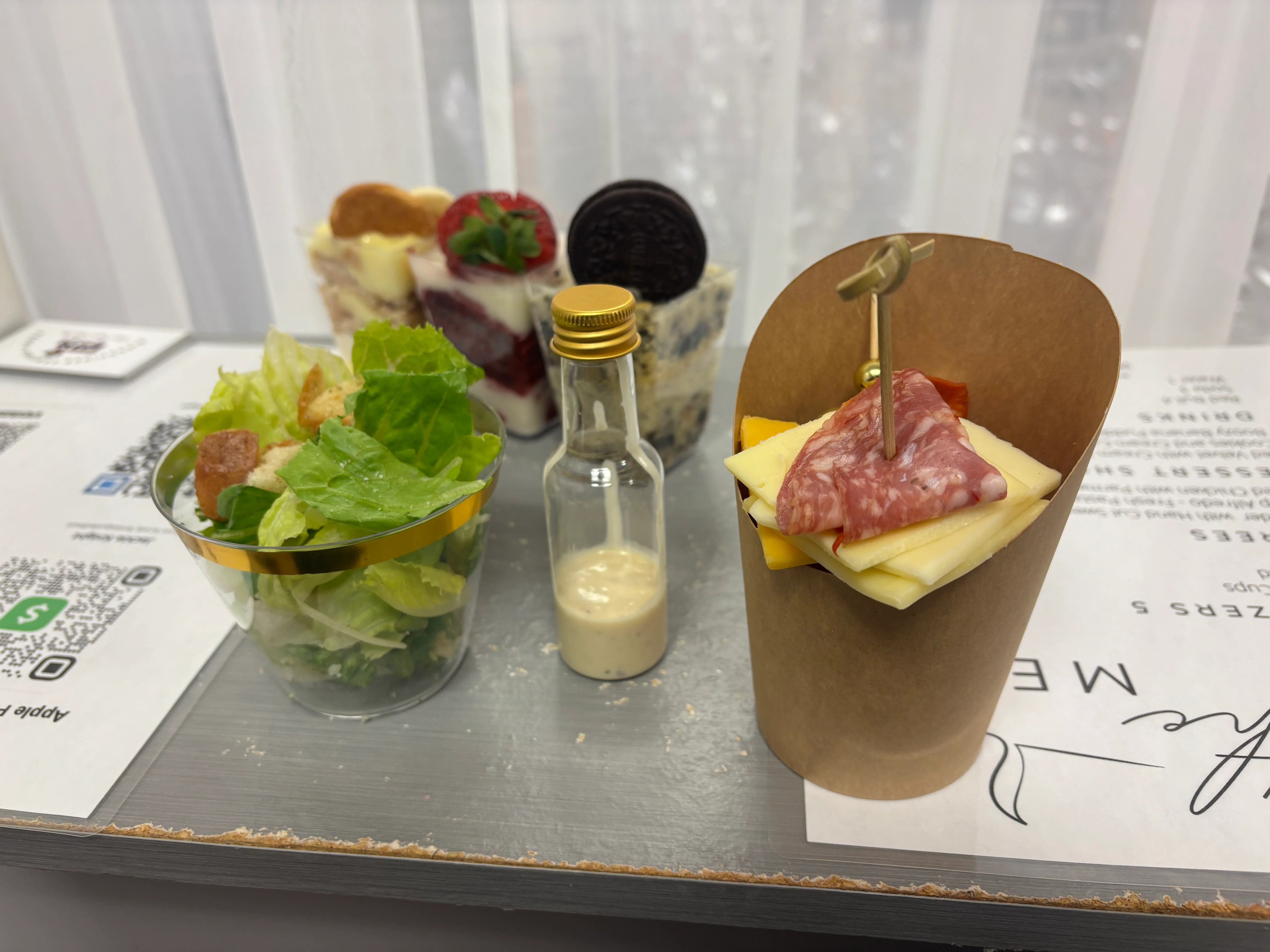 Charcuterie cup with assorted meats and cheese