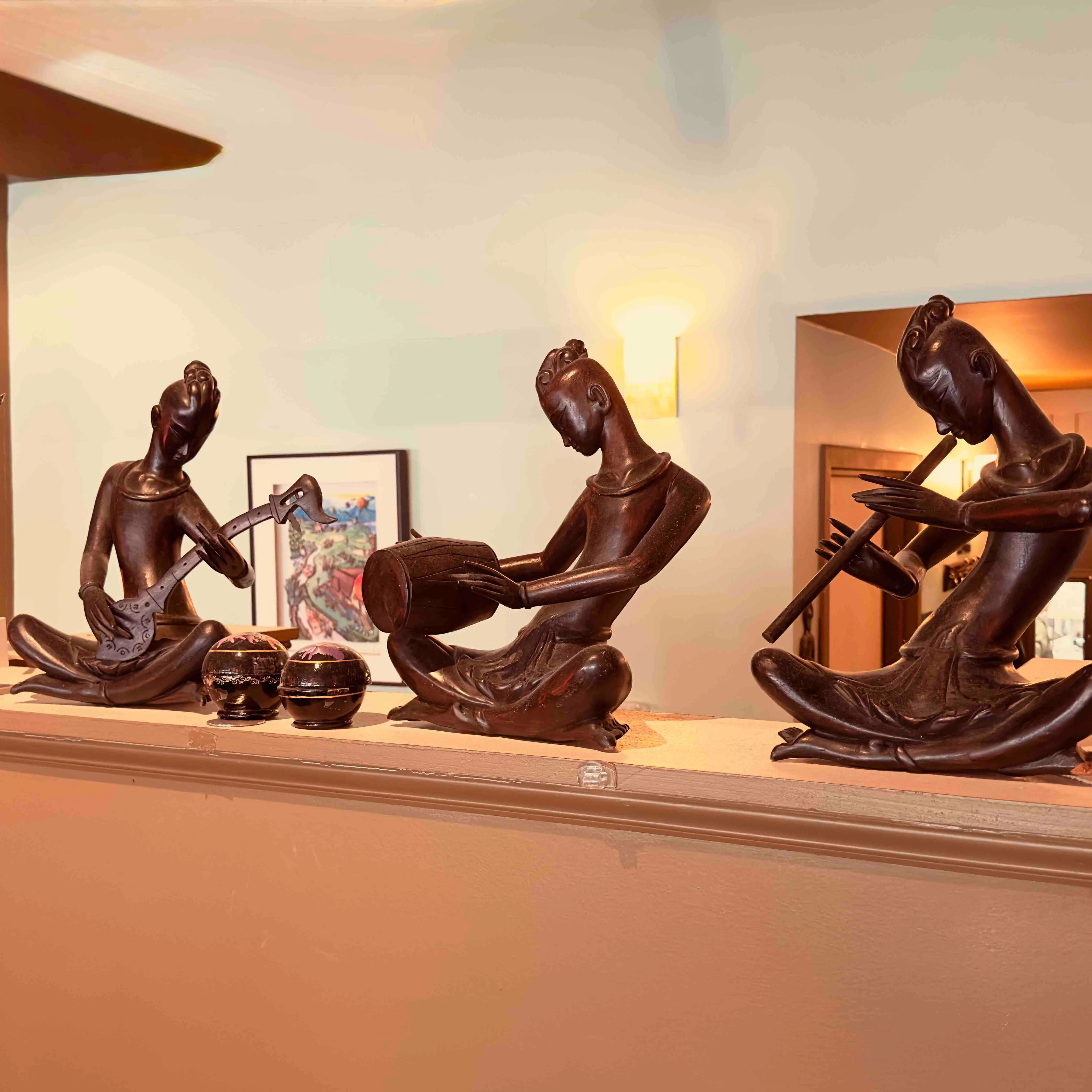 Artistic sculptures of musicians in a cozy restaurant setting