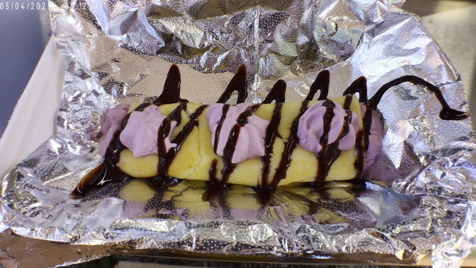 Delicious Mexican dessert with sweet cream and chocolate drizzle