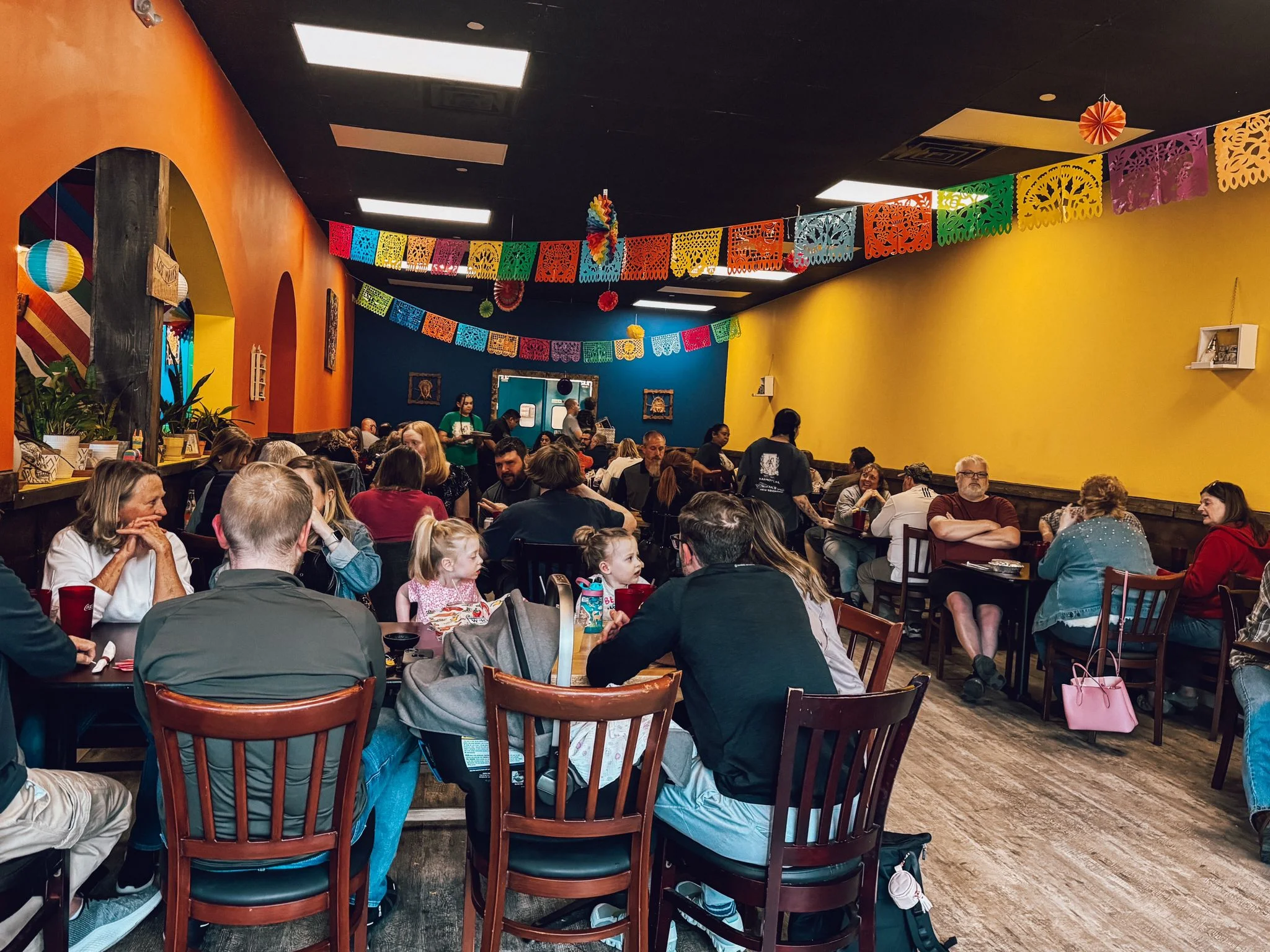 Vibrant restaurant interior with colorful decor and lively atmosphere