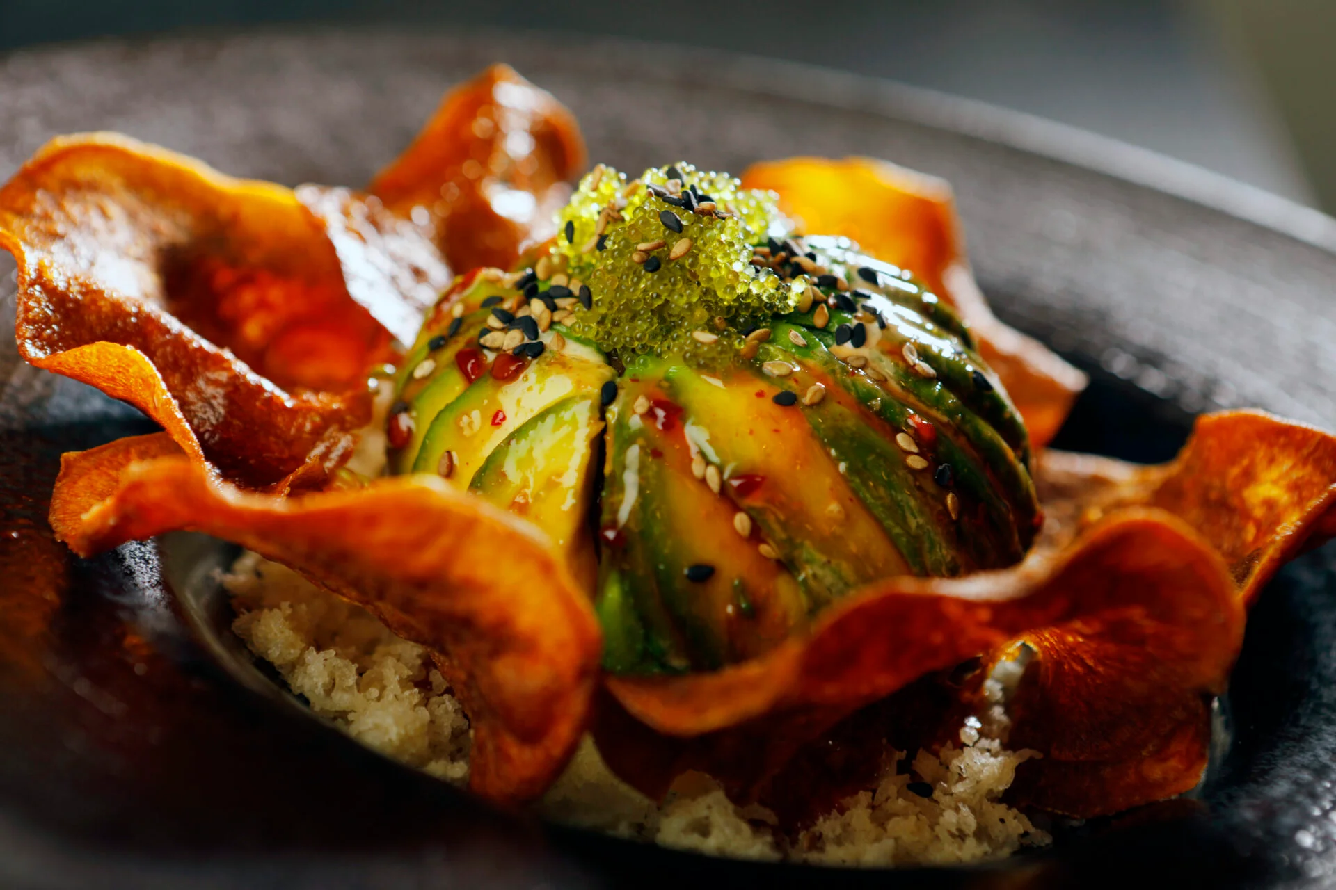 Artistic avocado tartare with crispy chips