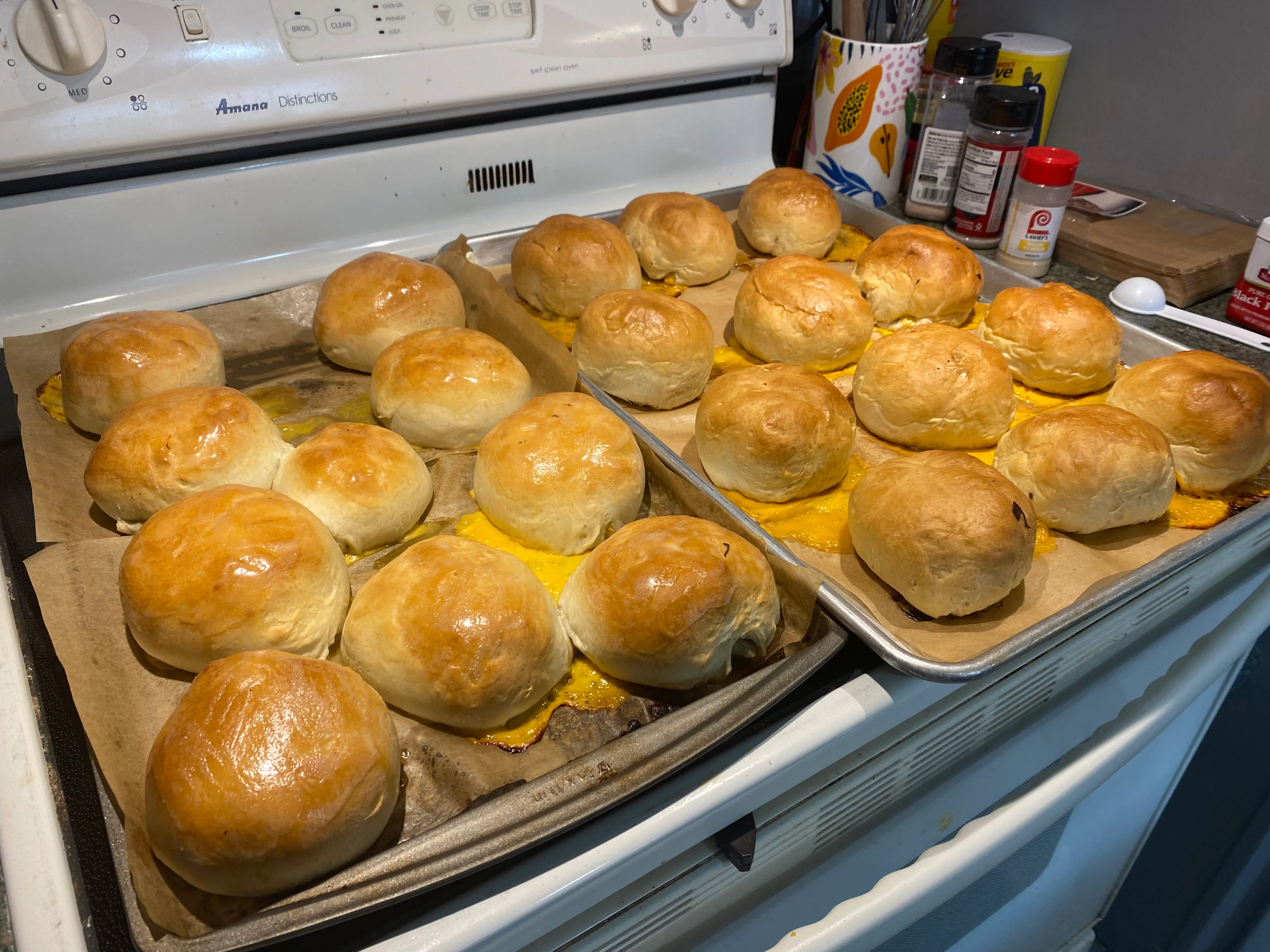 Freshly baked dinner rolls on a baking sheet