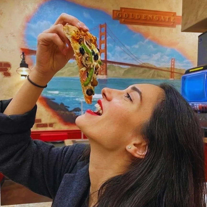 Delicious pizza with fresh toppings on a wooden table
