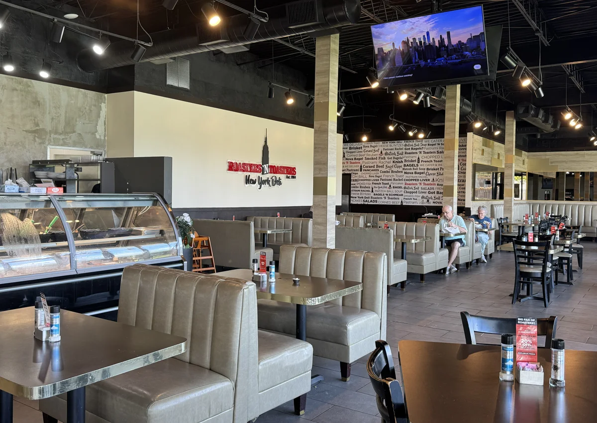 Dining room and deli counter inside Roasters ’N Toasters Hallandale