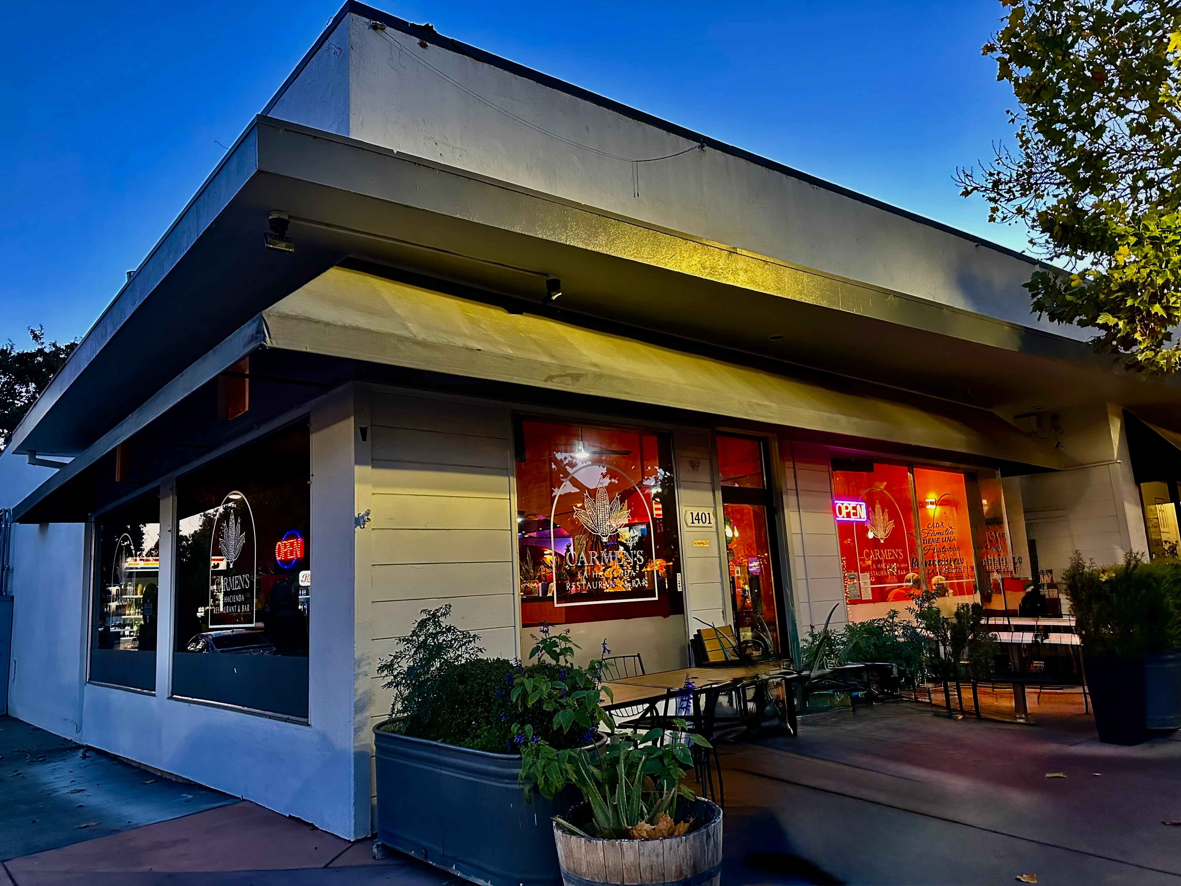 Charming restaurant exterior with warm lighting at dusk