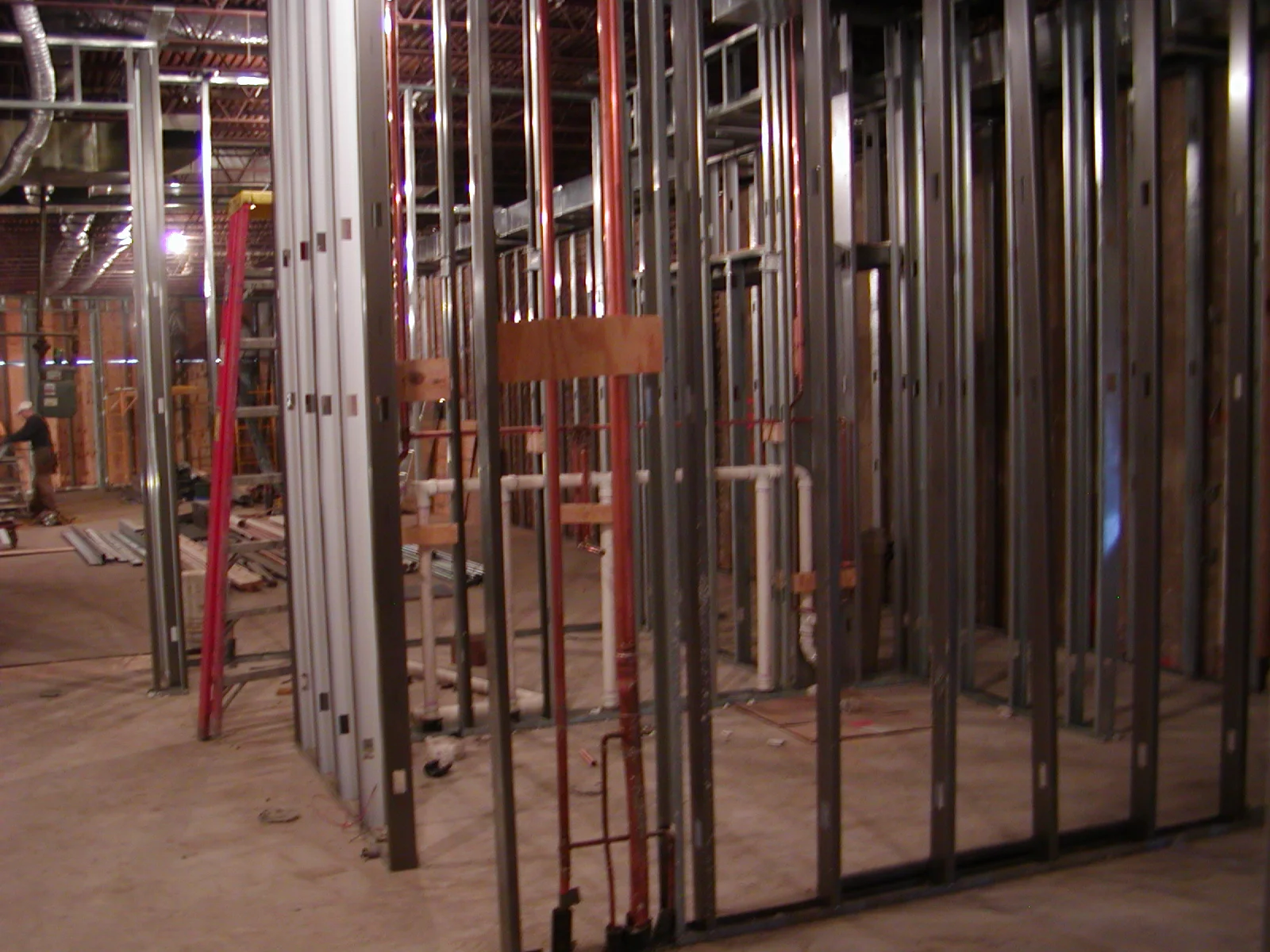 Construction site with metal framing and exposed infrastructure