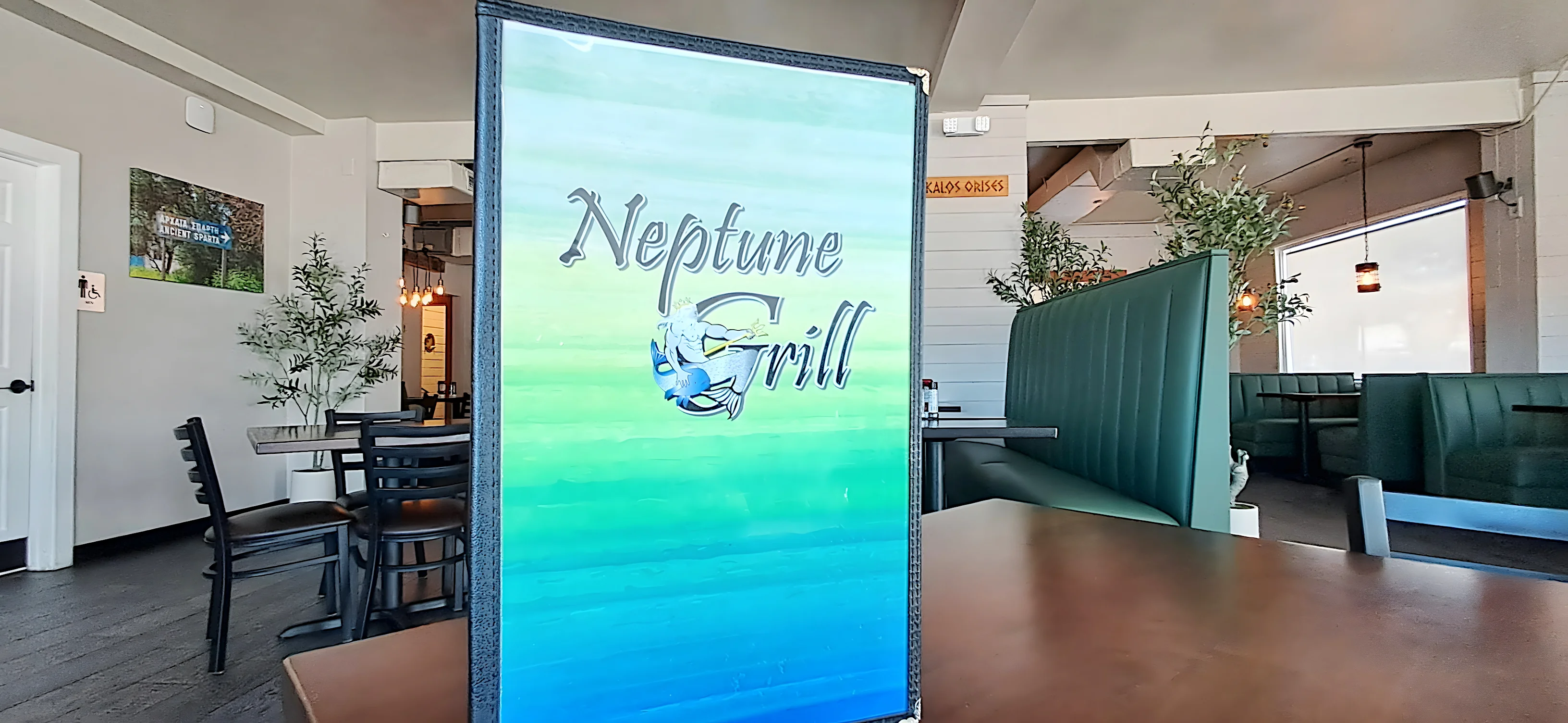 Interior of Neptune Grill restaurant with menu display