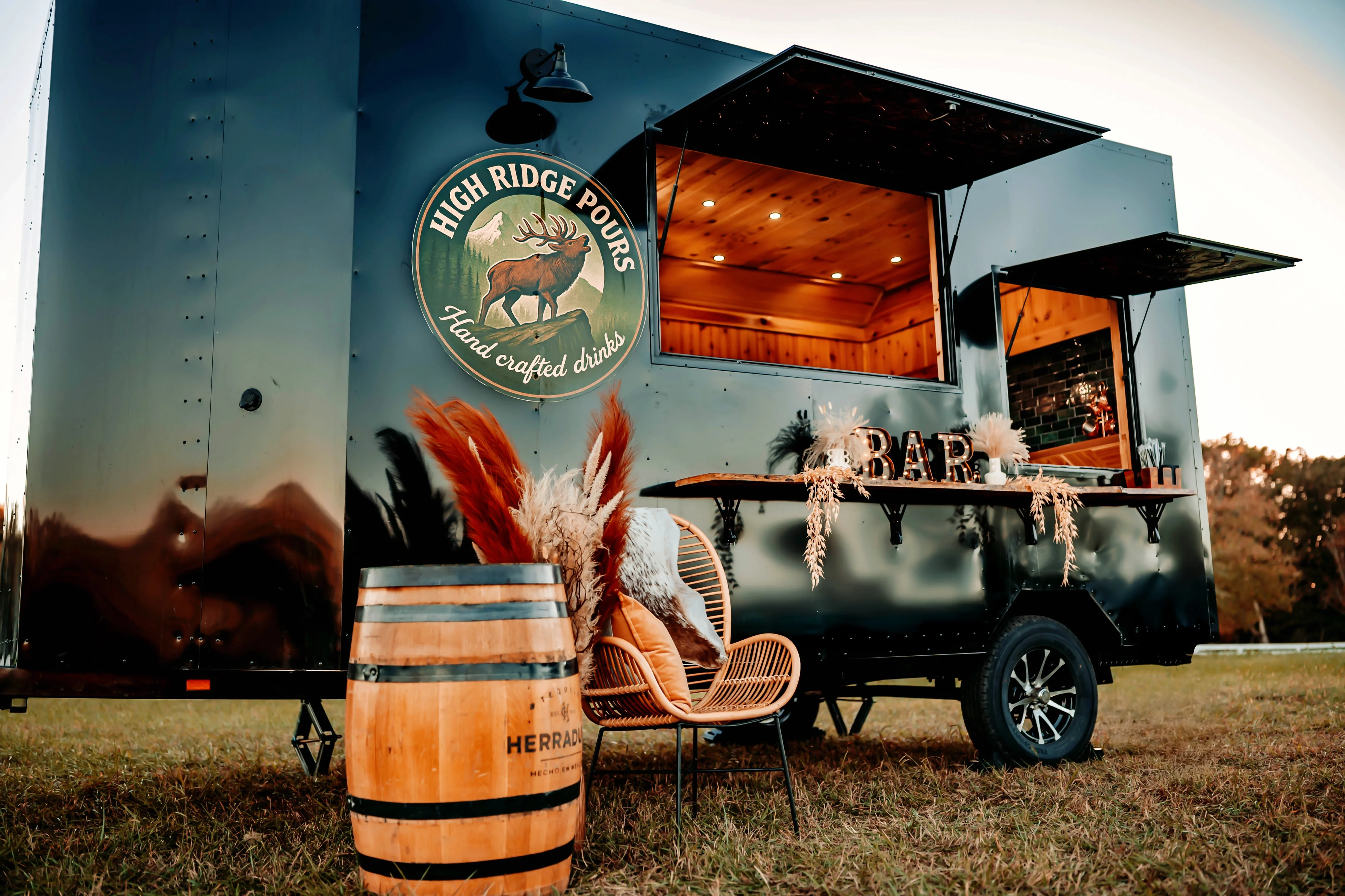 Mobile bar setup with handcrafted drinks and rustic decor