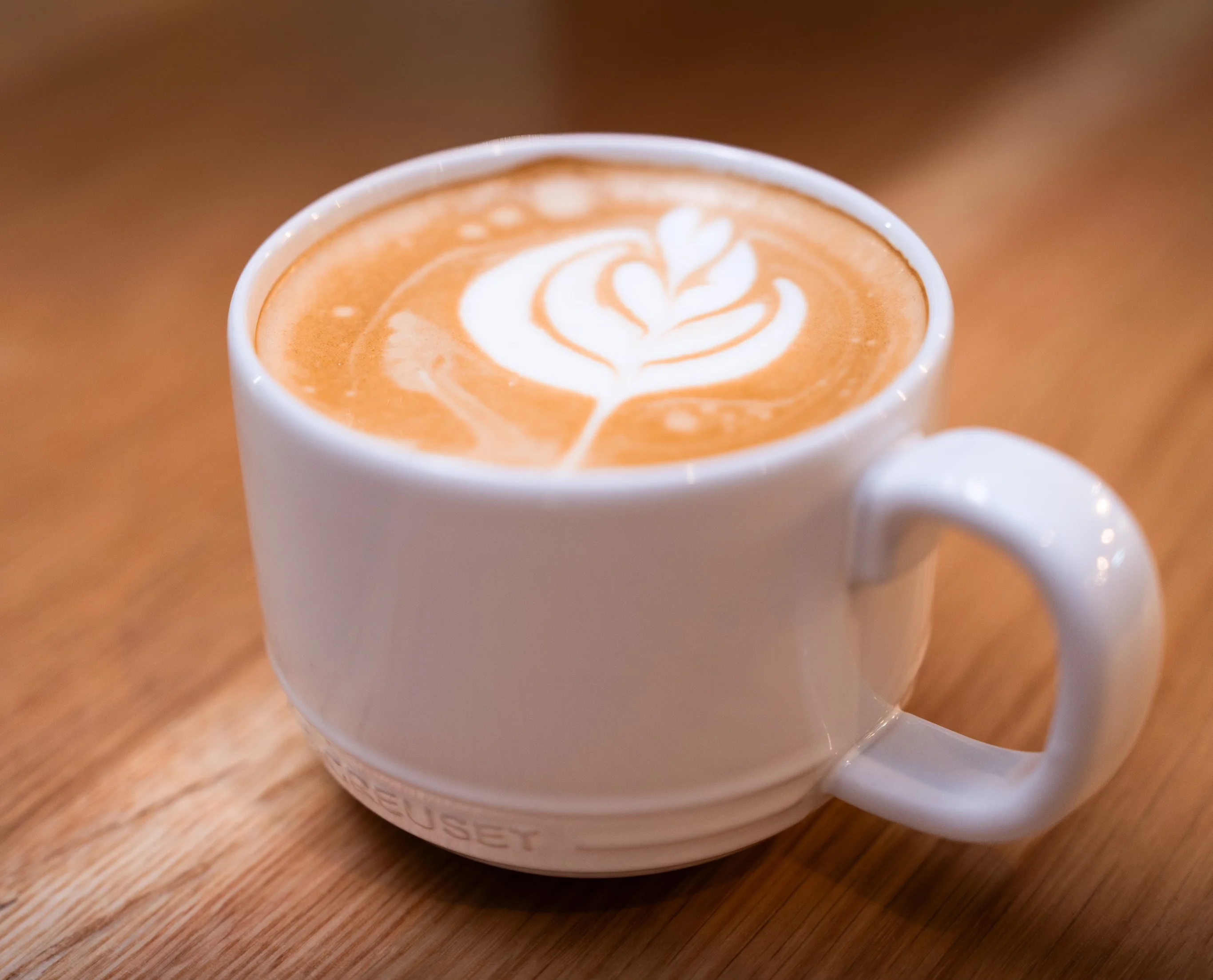 Artisan latte with beautiful leaf design