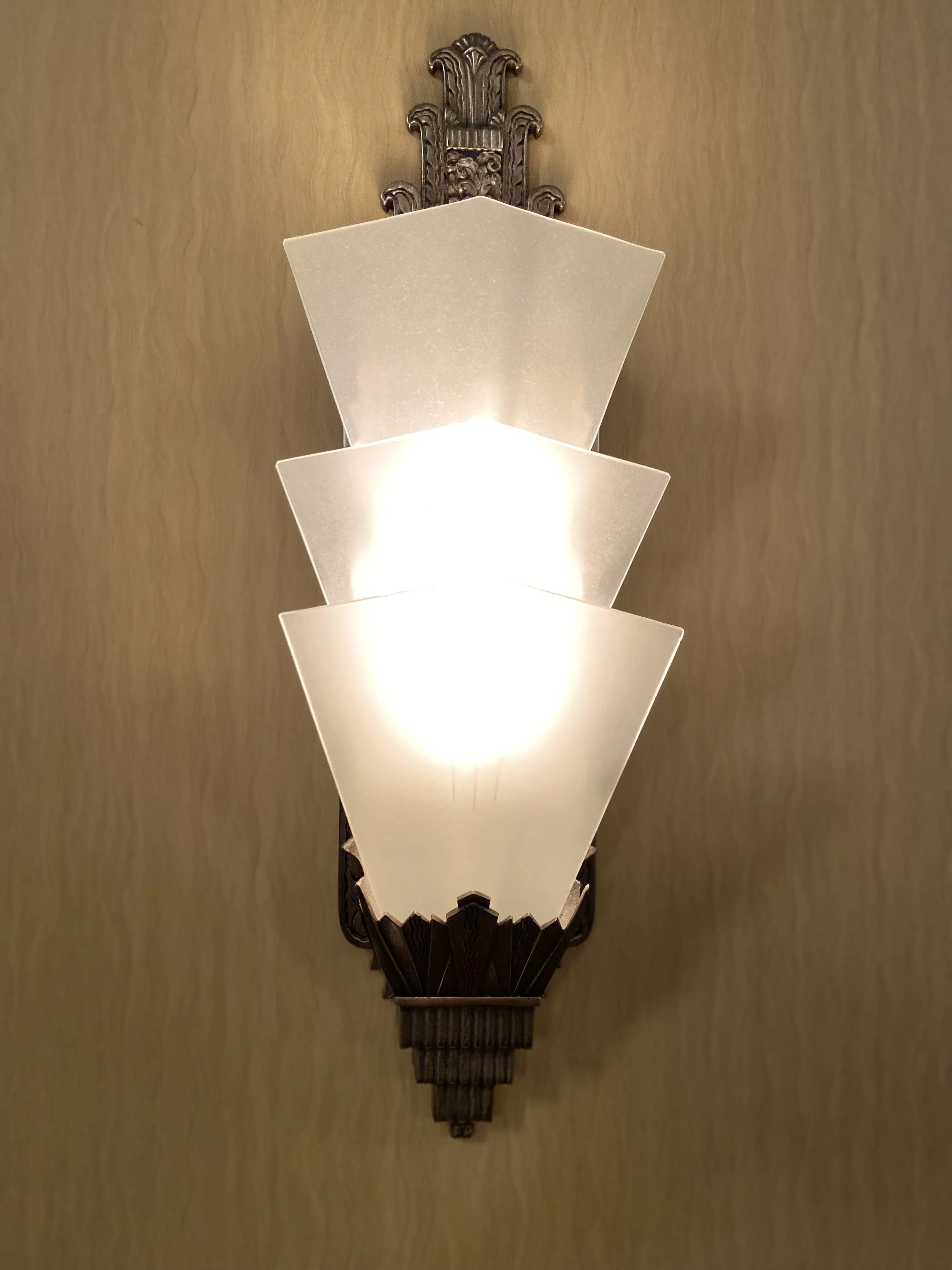 Elegant wall sconce lighting in a restaurant setting.