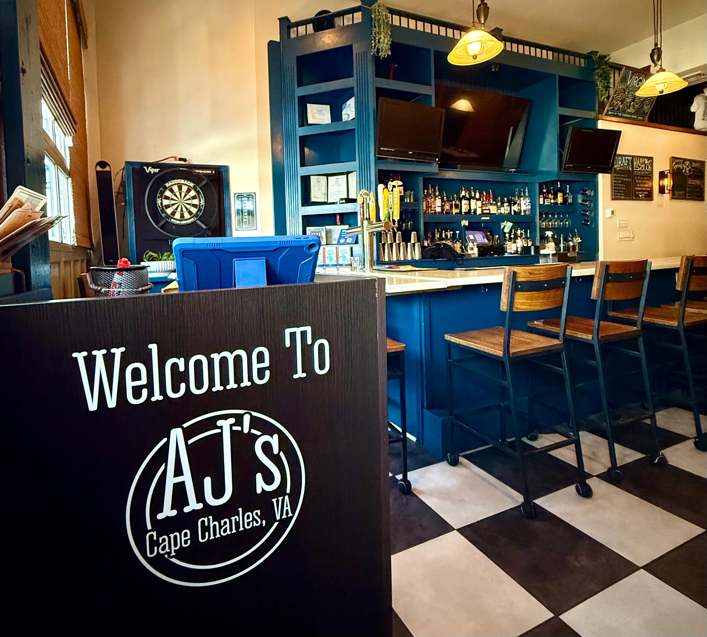 Welcoming bar area in a cozy restaurant with dartboard