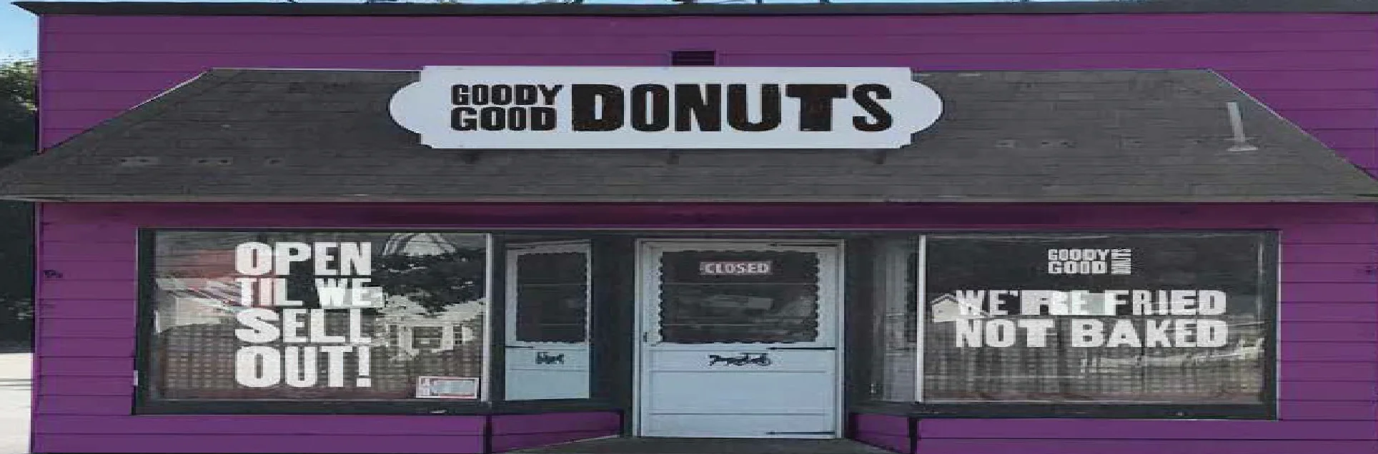 Colorful donut shop exterior with playful signage