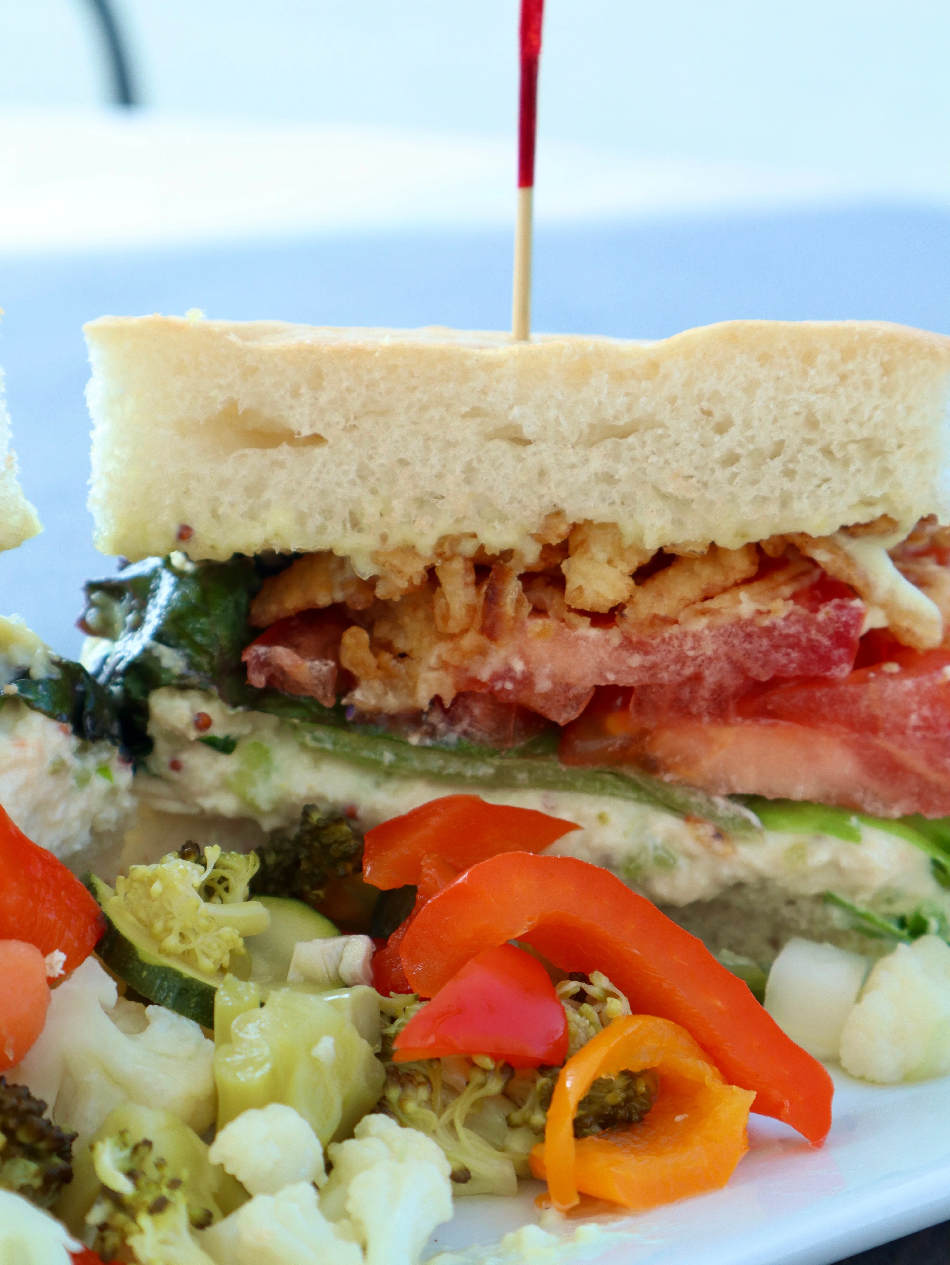 Delicious gourmet burger with fresh toppings on a wooden table