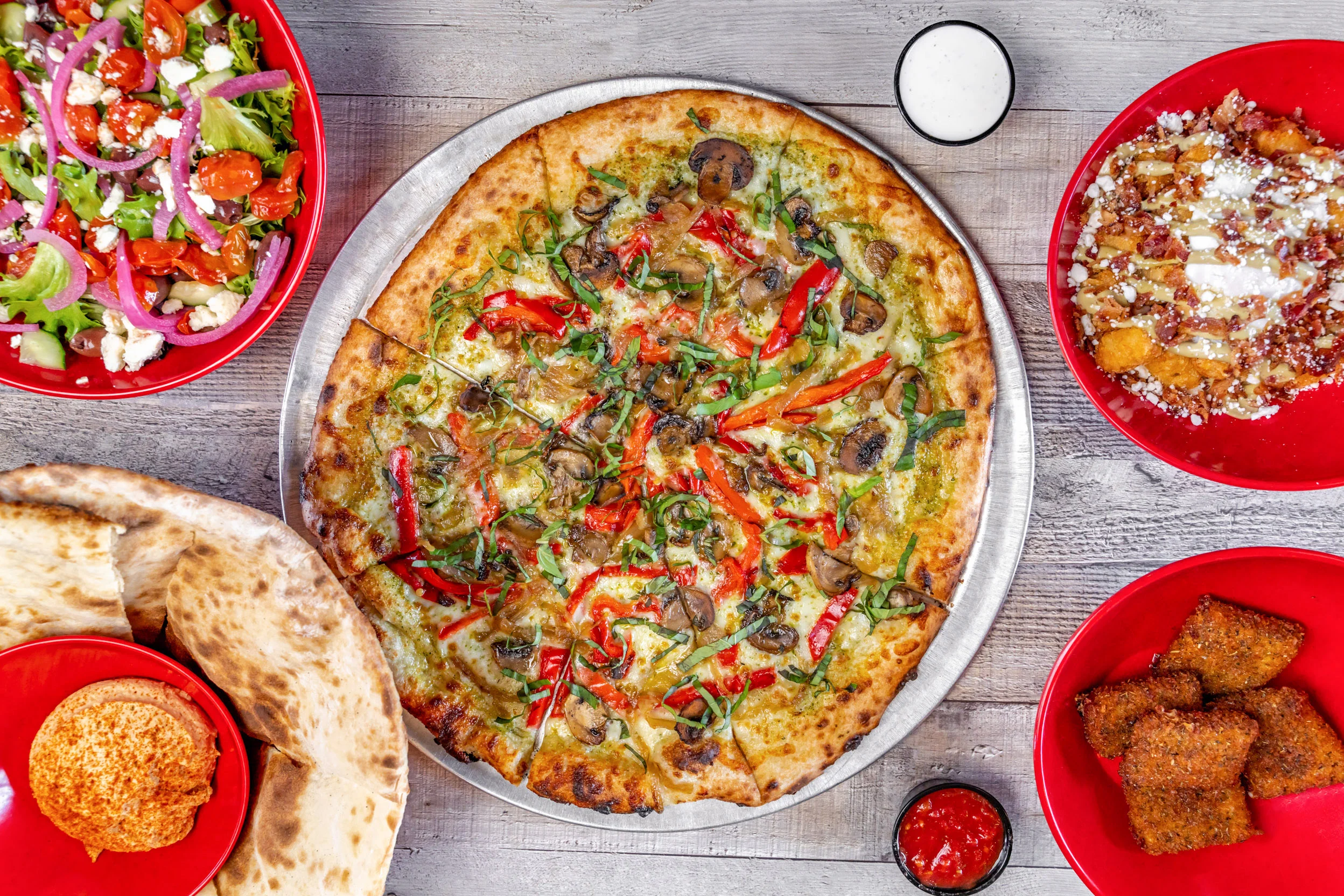 Vegetarian pizza with fresh vegetables and herbs