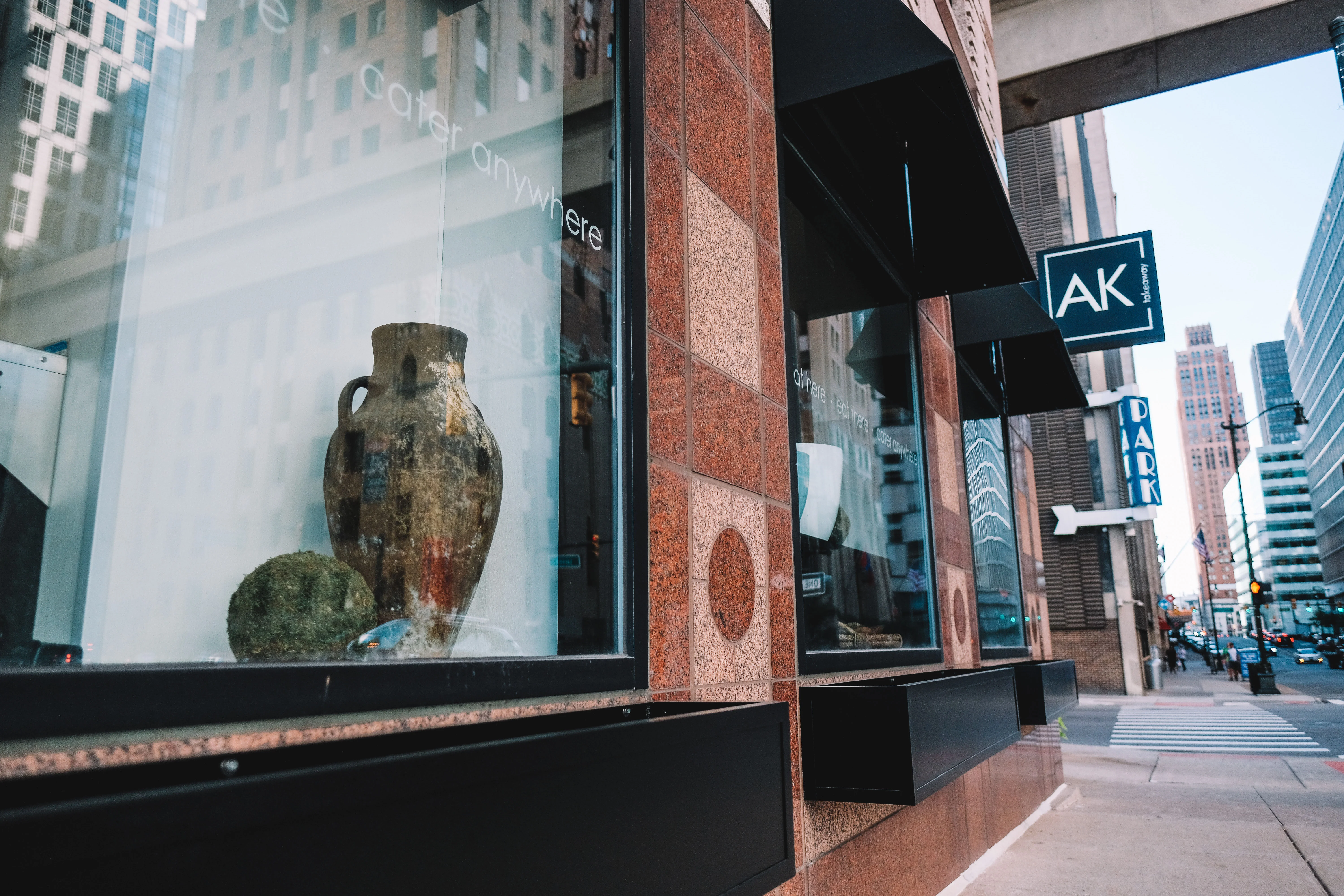 Restaurant exterior showcasing unique pottery in window display