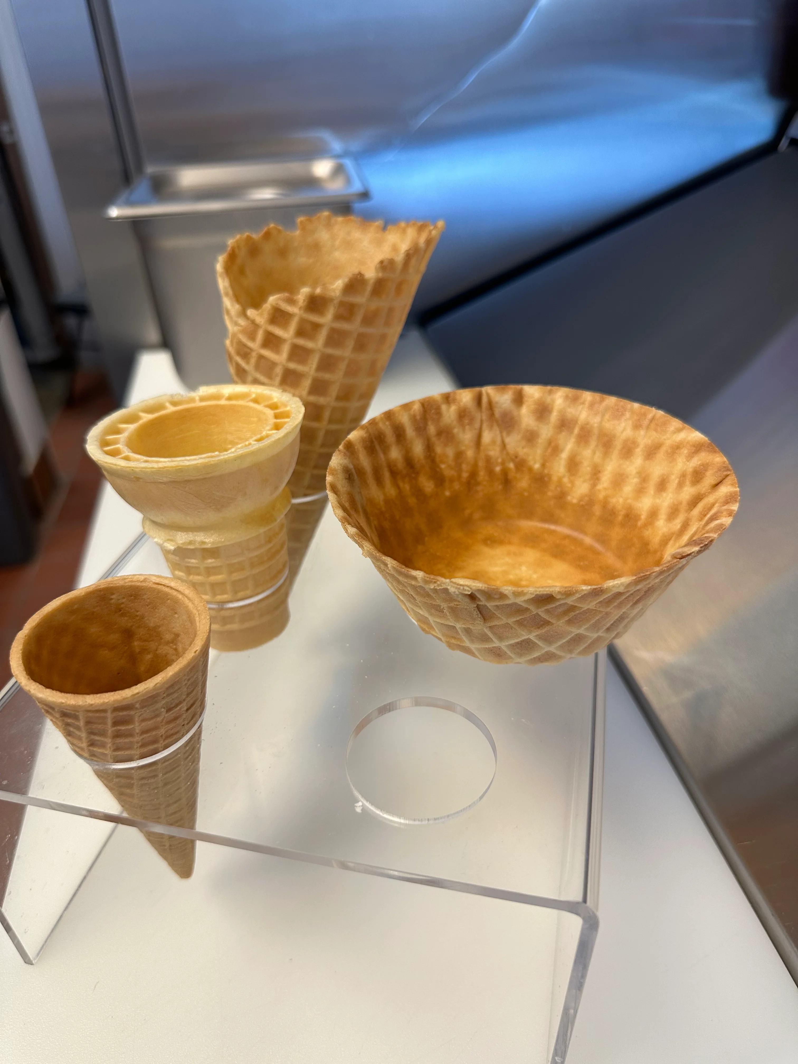 Variety of ice cream cones displayed in a showcase