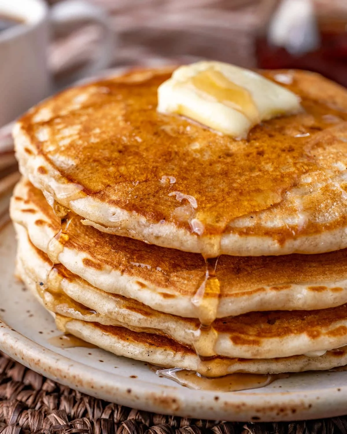 Fluffy buttermilk pancakes drizzled with syrup