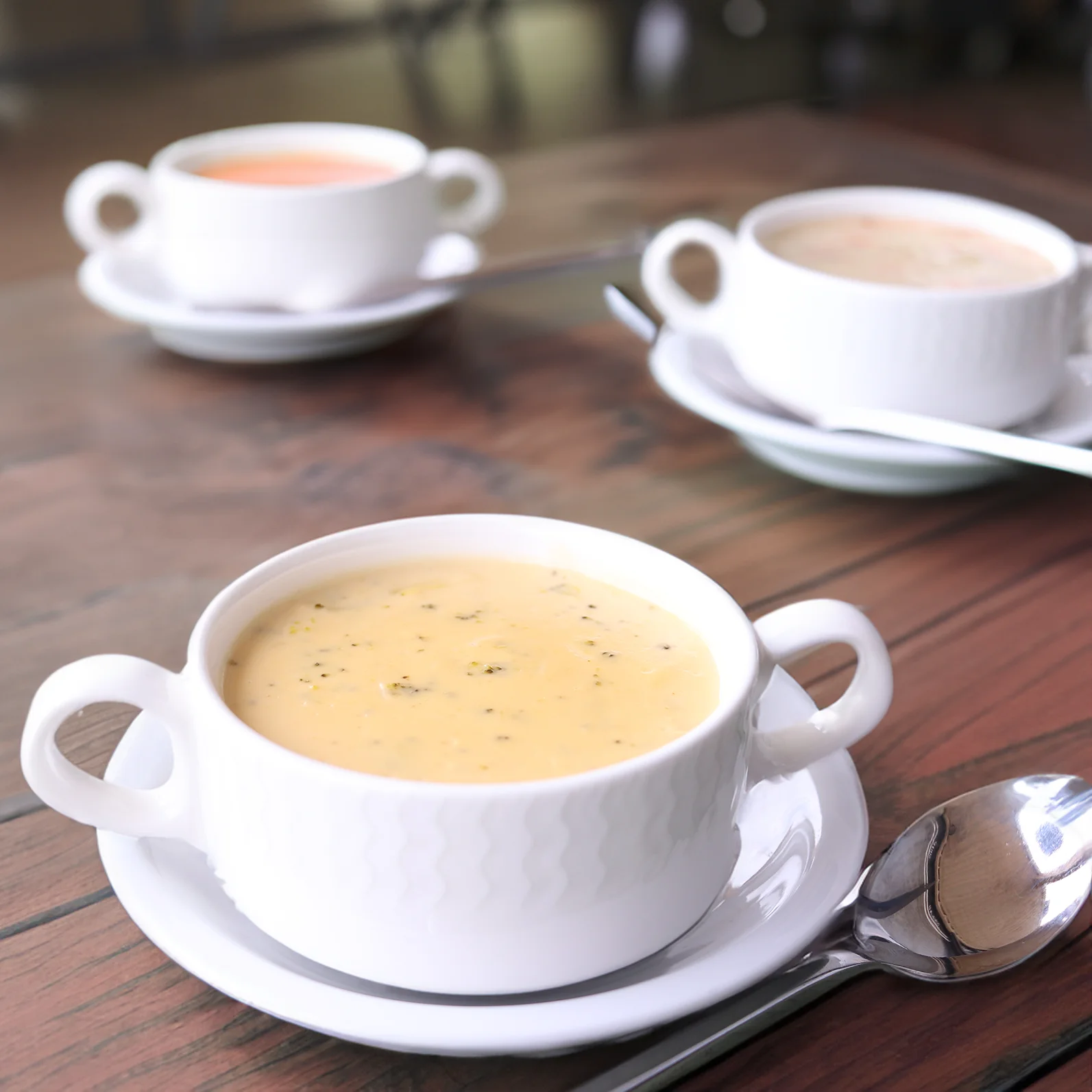 Creamy corn chowder served in a white cup