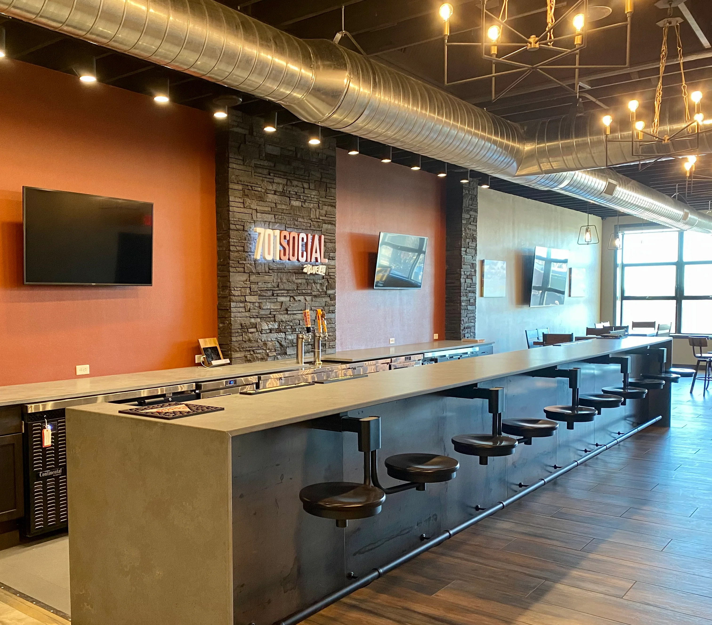 Modern bar interior with sleek design and warm lighting