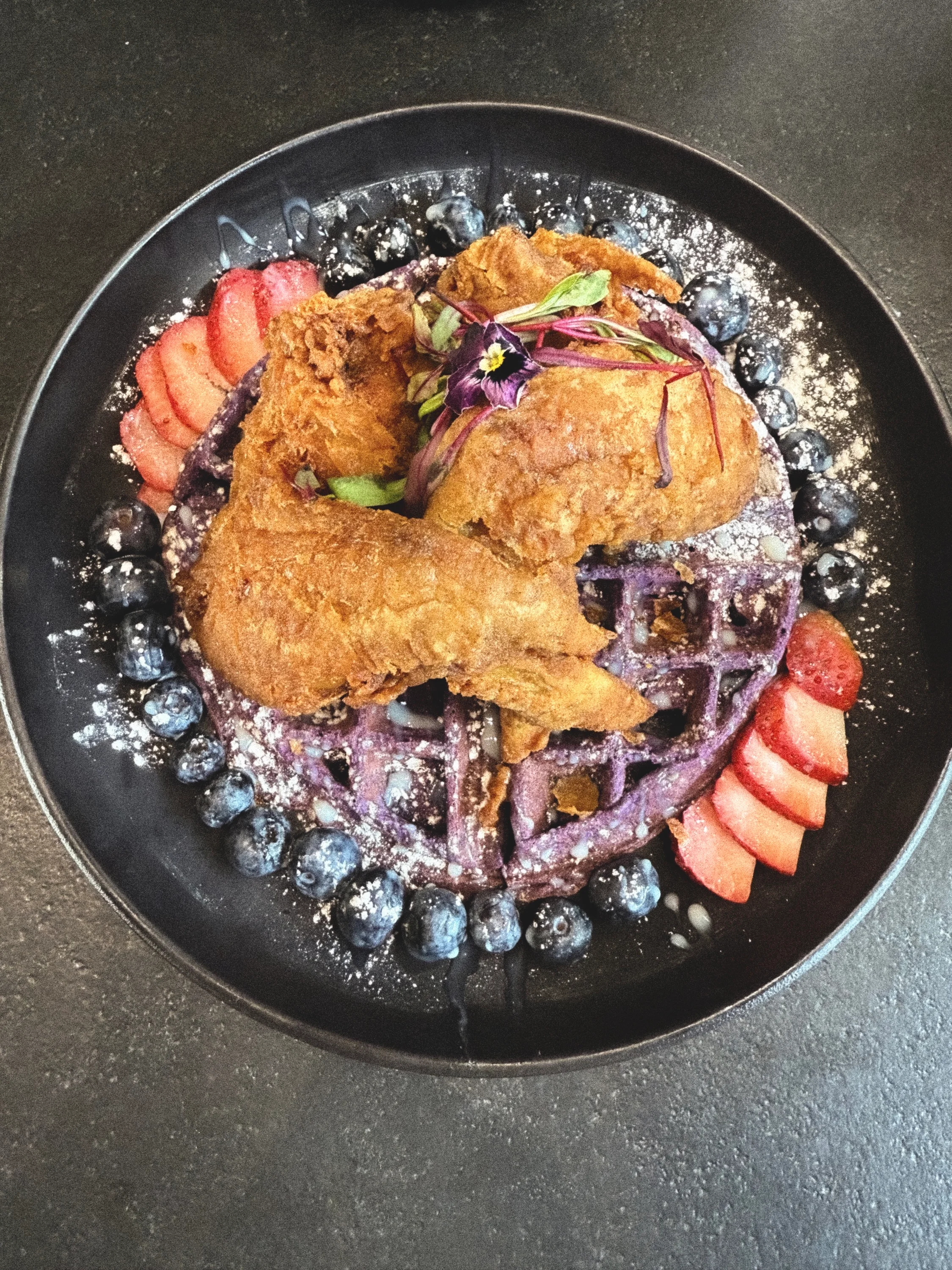 Southern fried chicken and waffles with berries