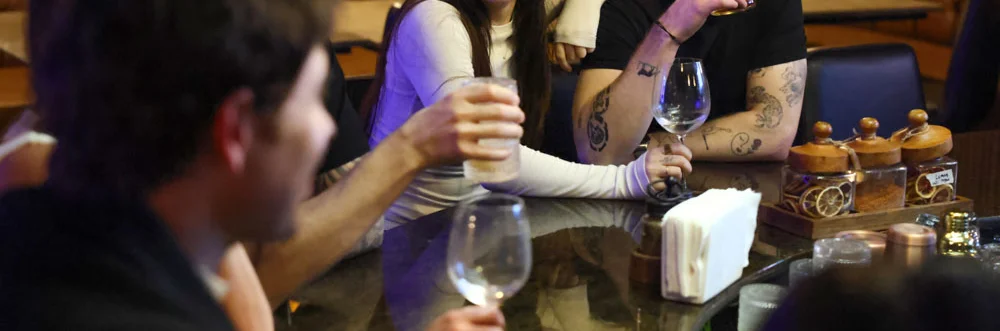 Group of friends enjoying drinks at a stylish bar