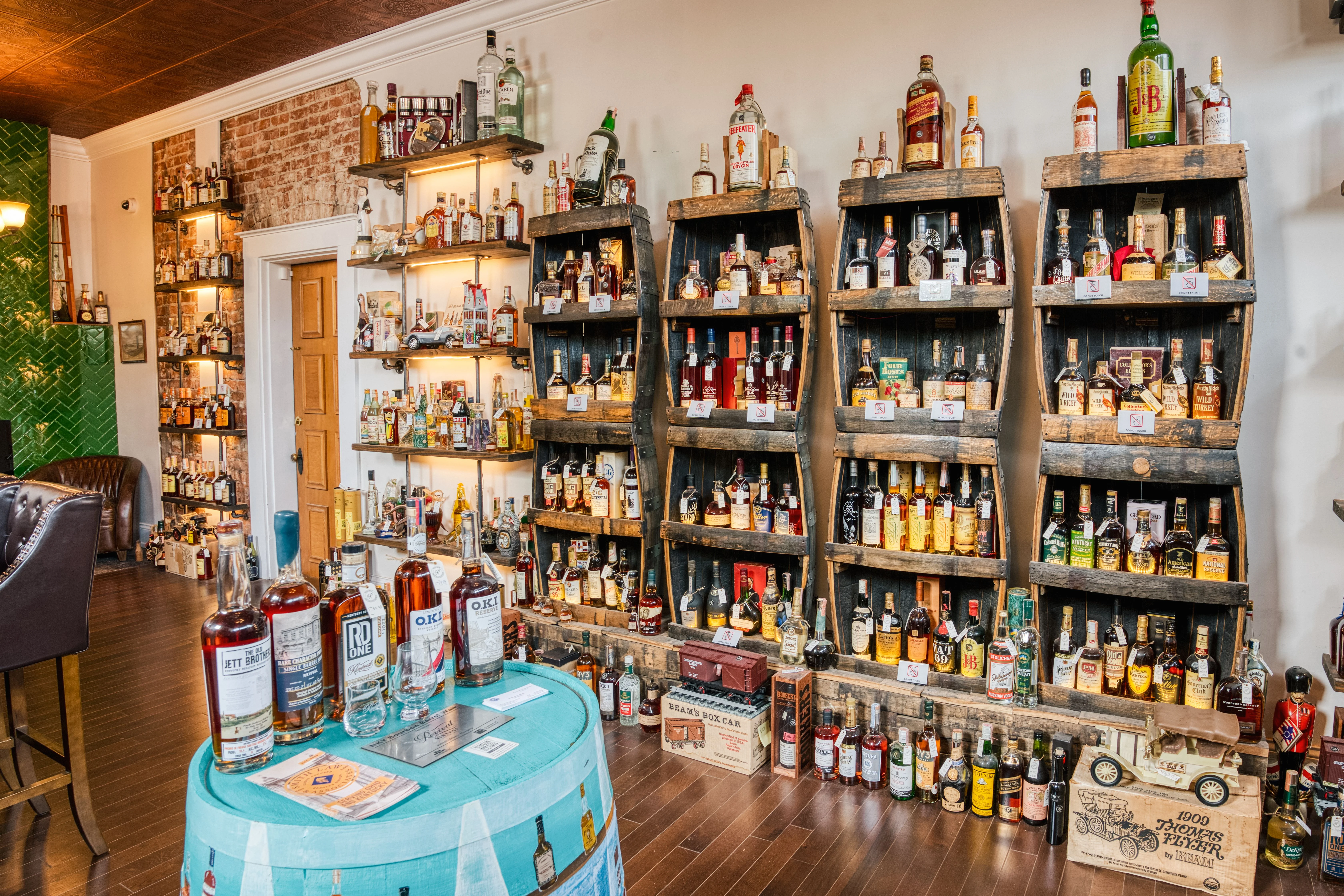 Well-stocked bar with various spirits and vintage decor