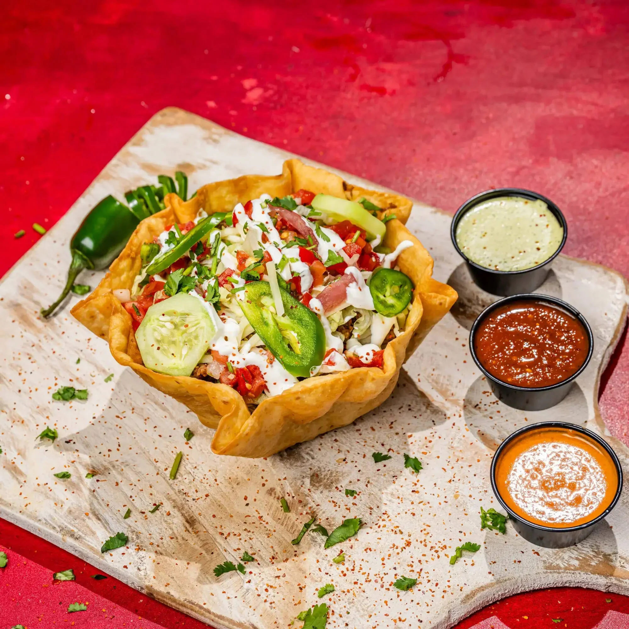 Cut-open Mexican burrito served on a wooden board