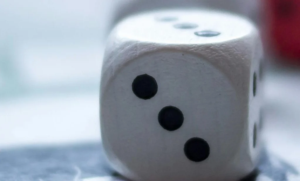 Colorful game pieces and dice on a board game