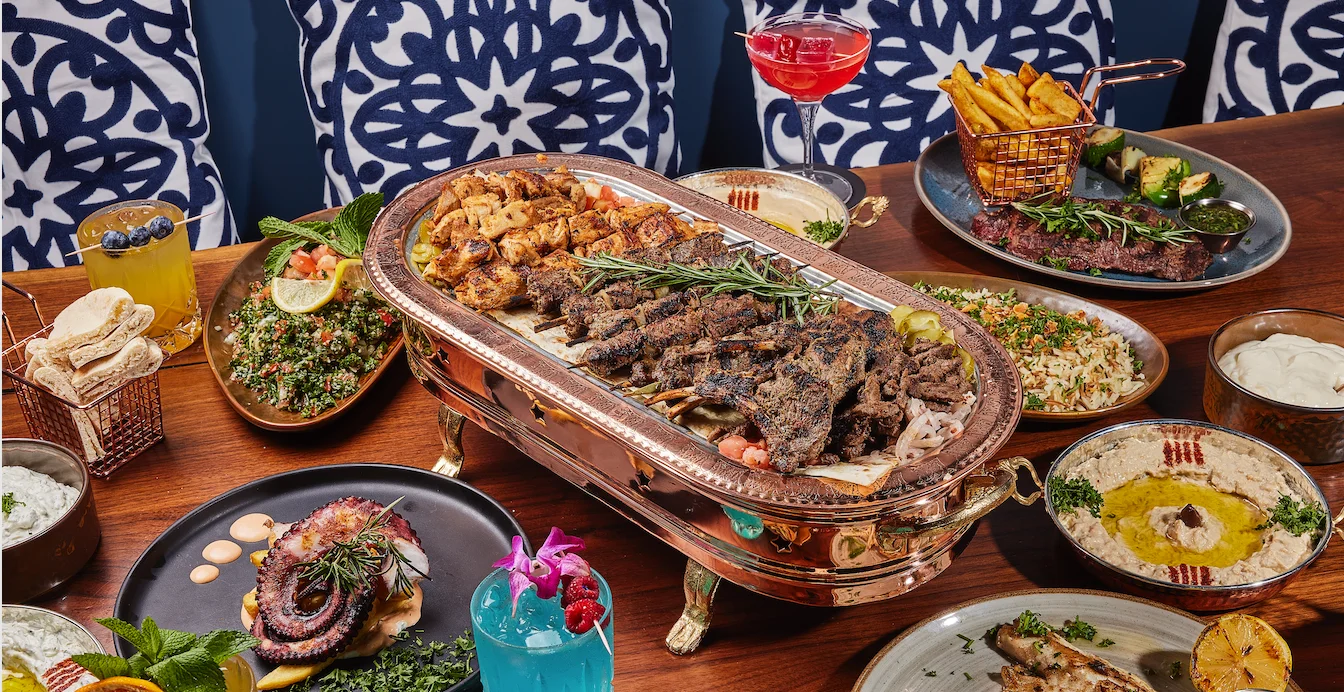 Mediterranean mixed grill platter with kebabs and sides