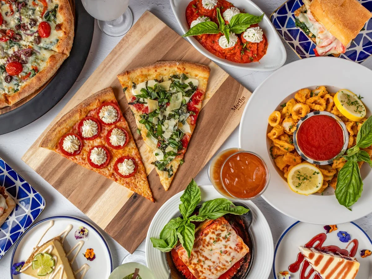 New York Style pizza, slices, fried calamari, and Italian appetizers at Amici Brick Oven Pizza, West Palm Beach