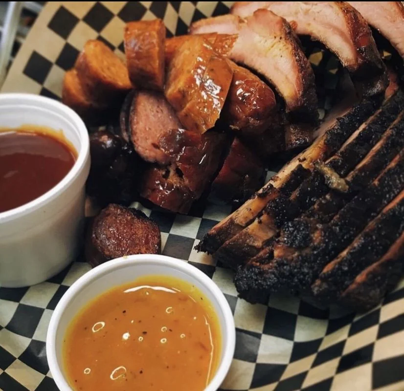 Assorted barbecue platter featuring smoked meats