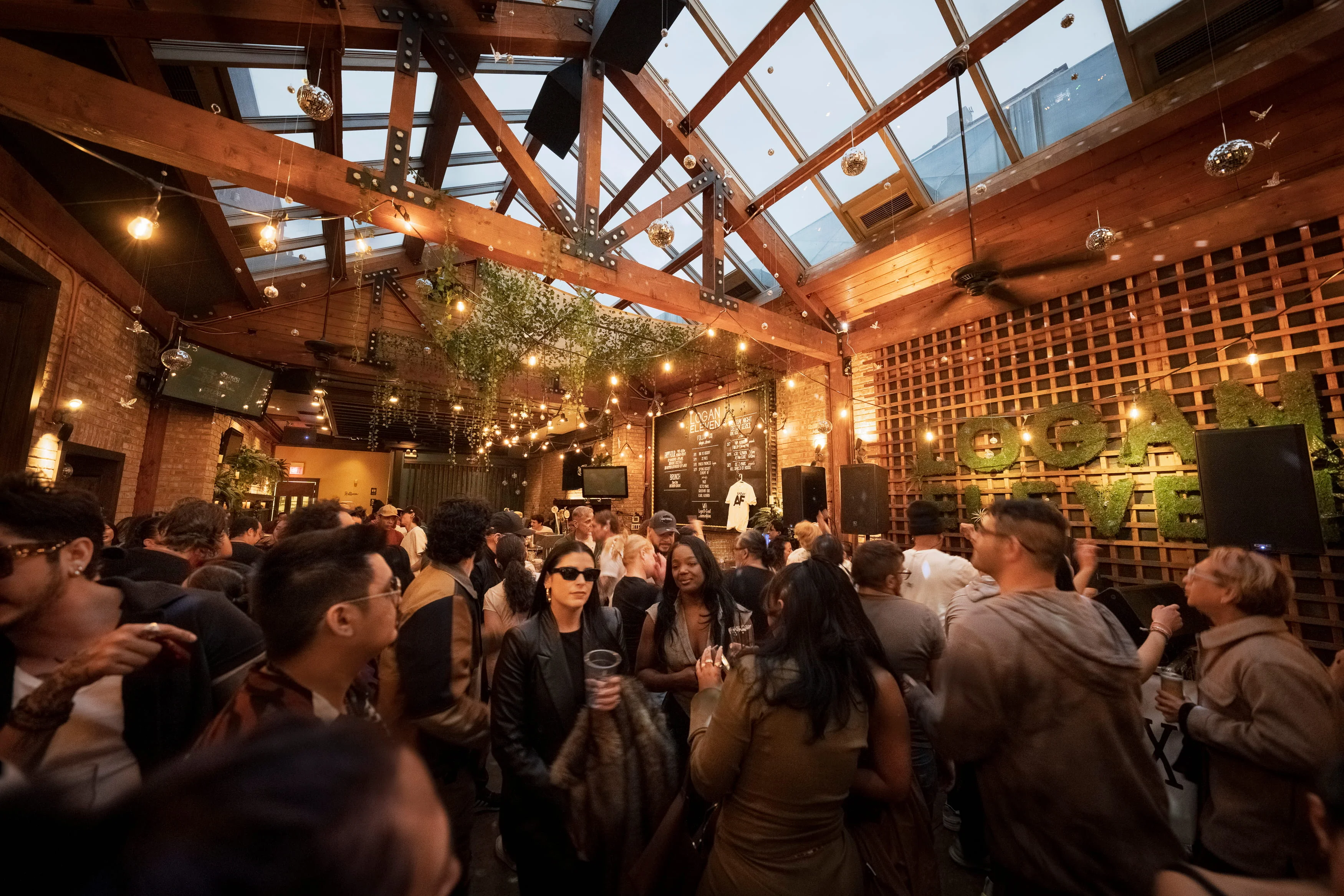 Vibrant restaurant interior with lively crowd and warm lighting