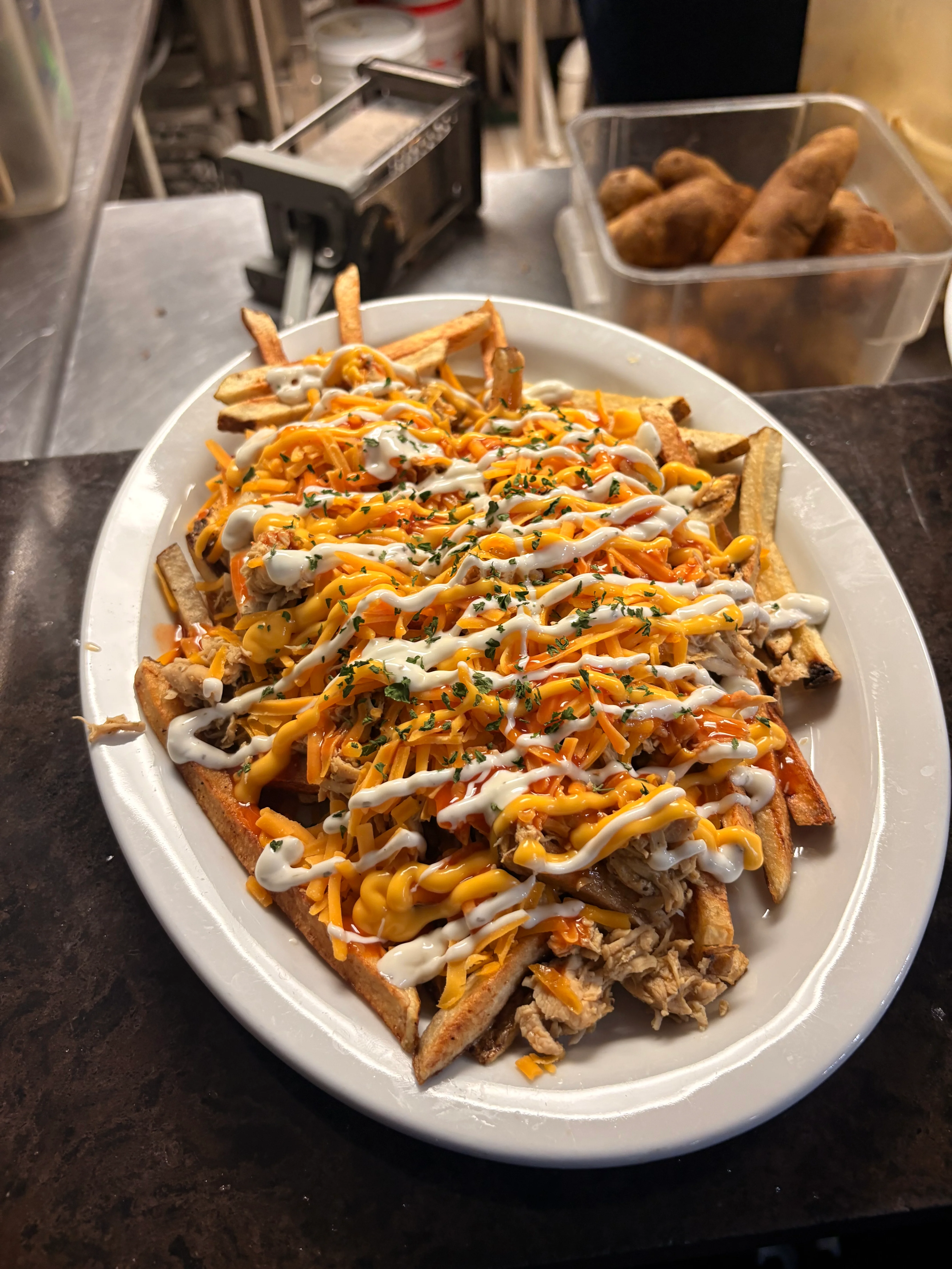 Loaded fries topped with cheese and sauce, a popular comfort food dish