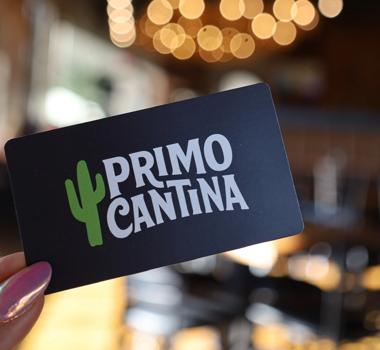 Primo Cantina restaurant gift card with warm bokeh background
