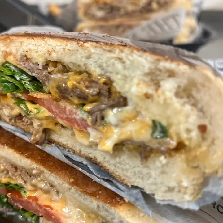 Cuban sandwich with ham and pork on toasted bread