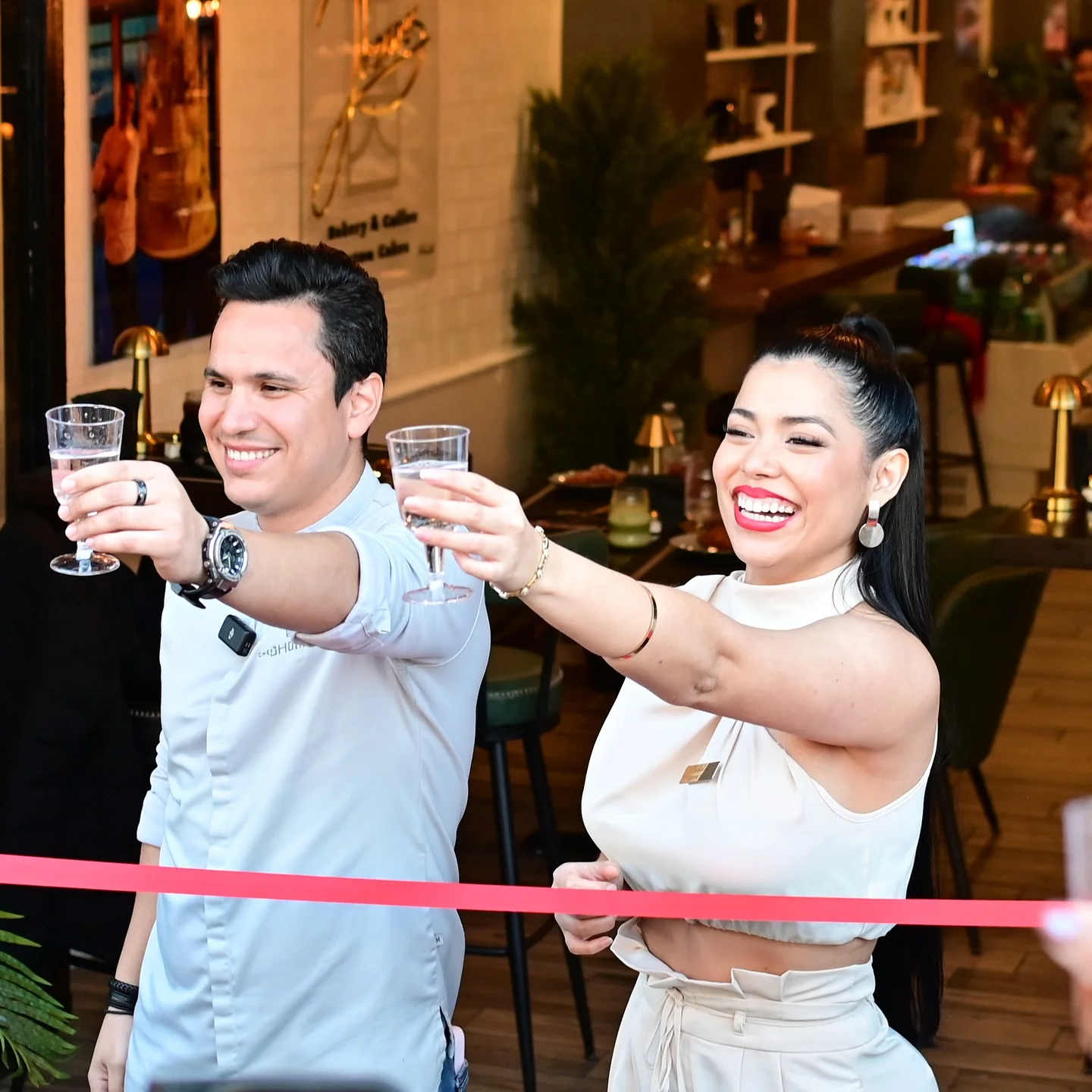 Celebratory toast at a restaurant opening event