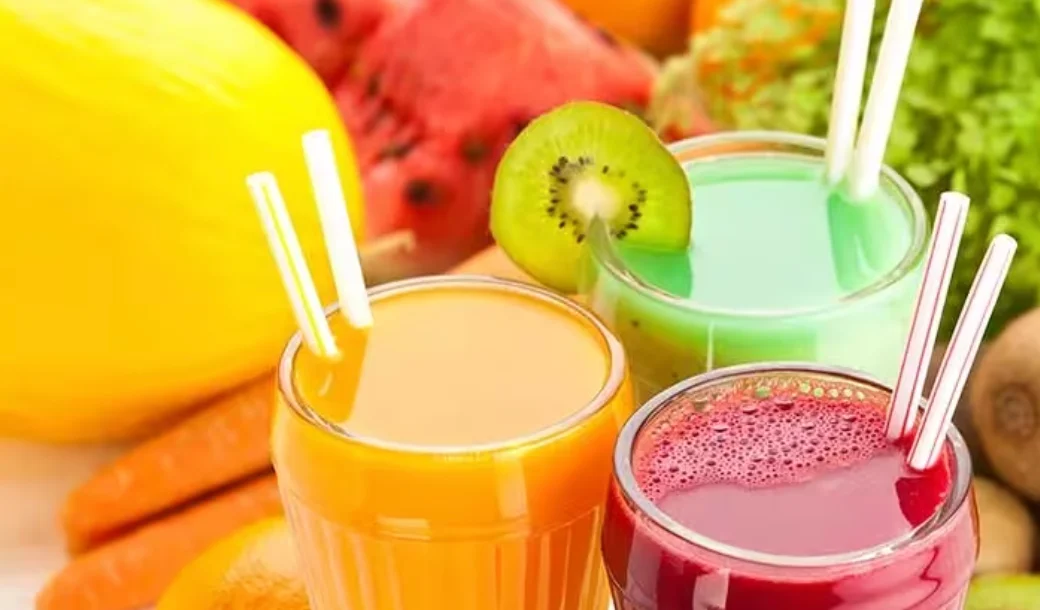 Colorful fruit smoothies in glasses with fresh ingredients
