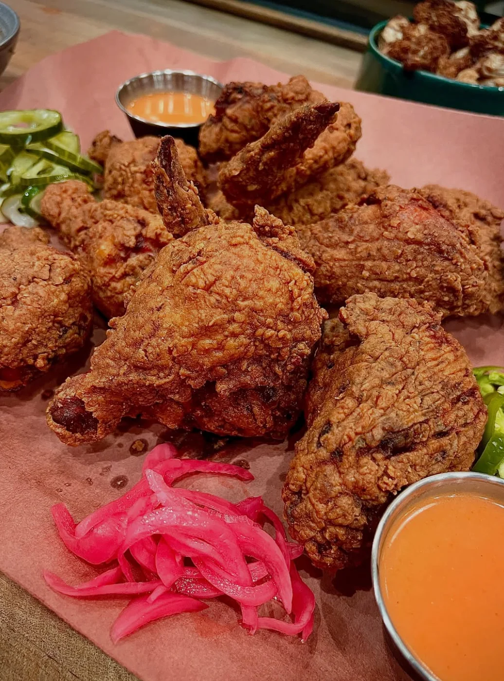 Crispy Southern fried chicken with pickled onions and dipping sauce