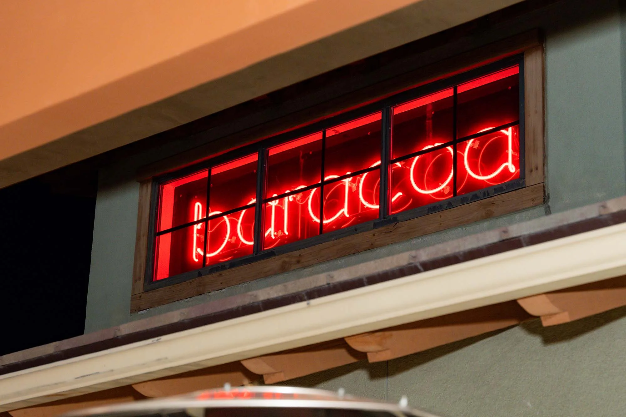 Neon Baracoa Sign on restaurant patio