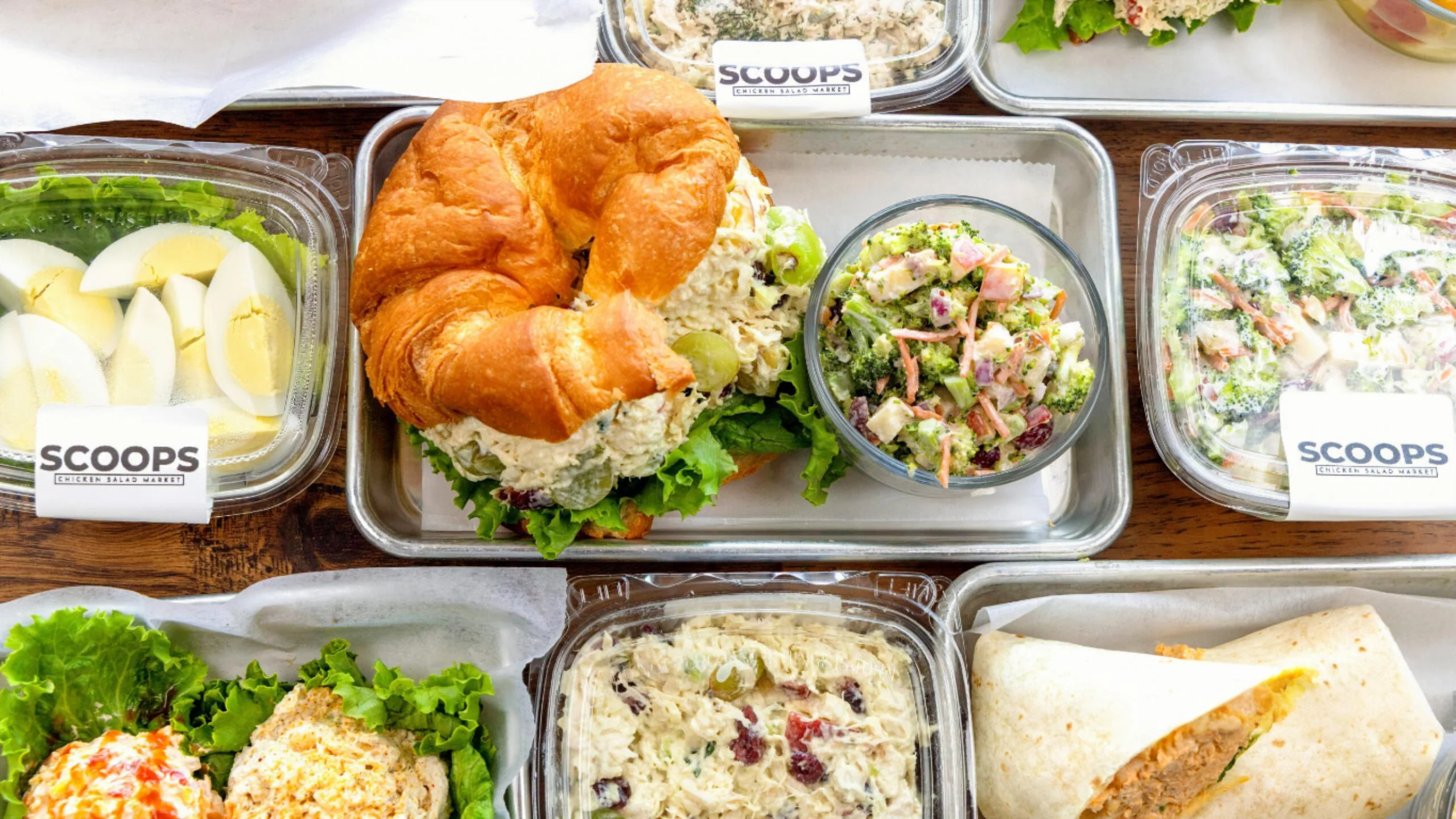 Chicken salad croissant sandwich with sides
