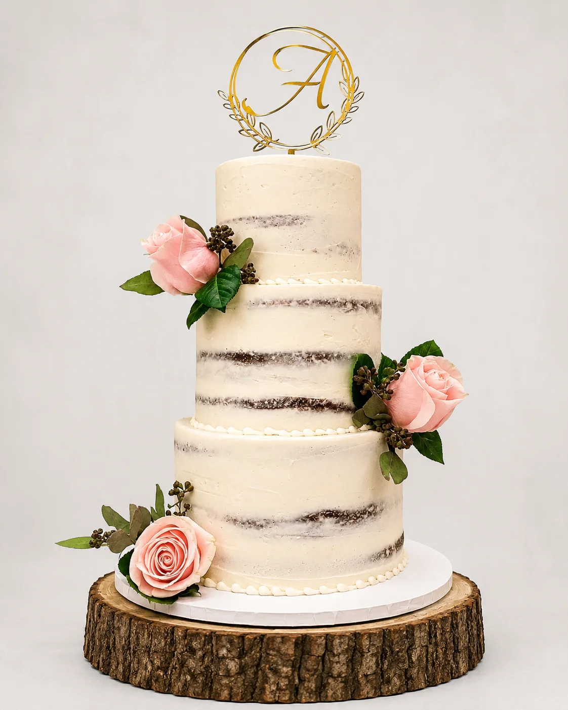 Elegant three-tier wedding cake with floral accents