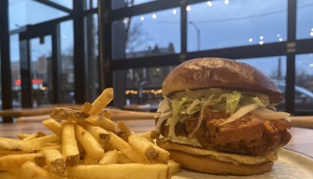 Crispy fried chicken sandwich with fries