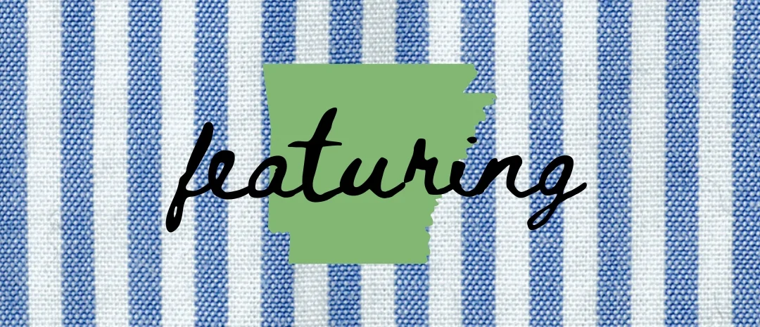 Stylish fabric background with Arkansas state outline and 'featuring' text