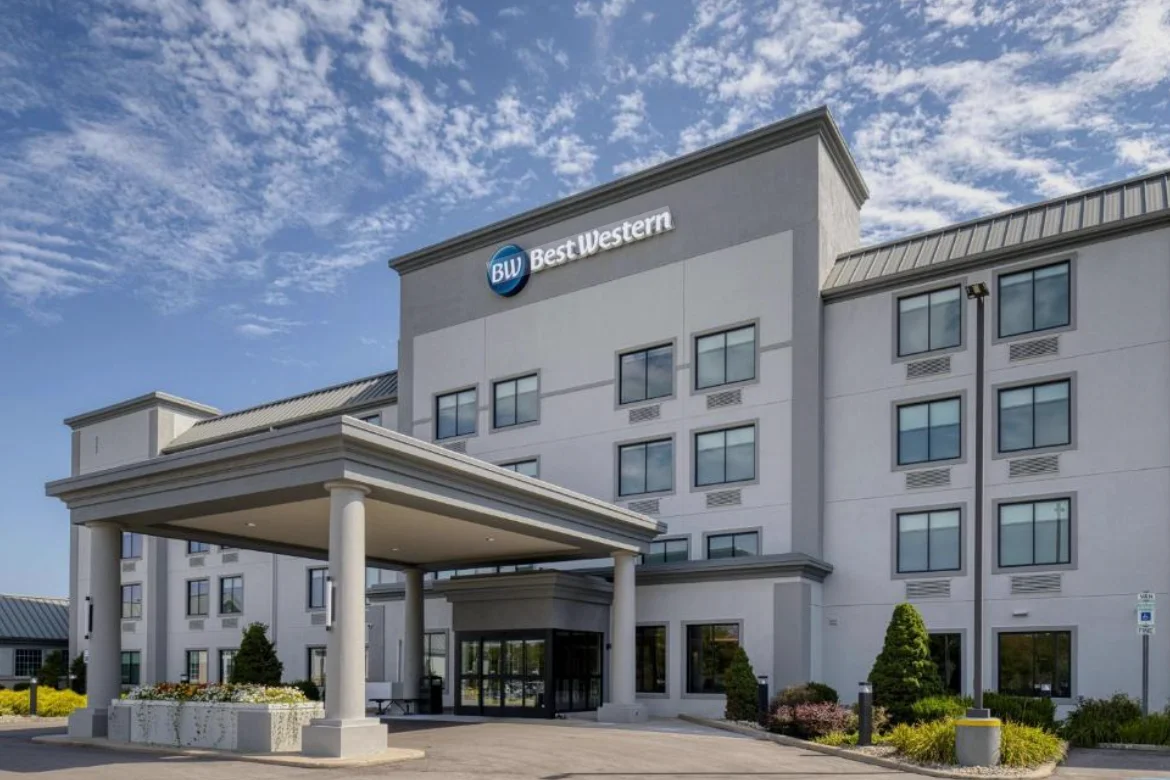 Modern hotel exterior with clear blue sky and welcoming entrance