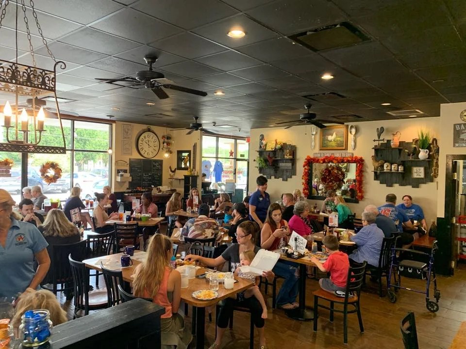 Cozy restaurant interior bustling with diners and warm decor