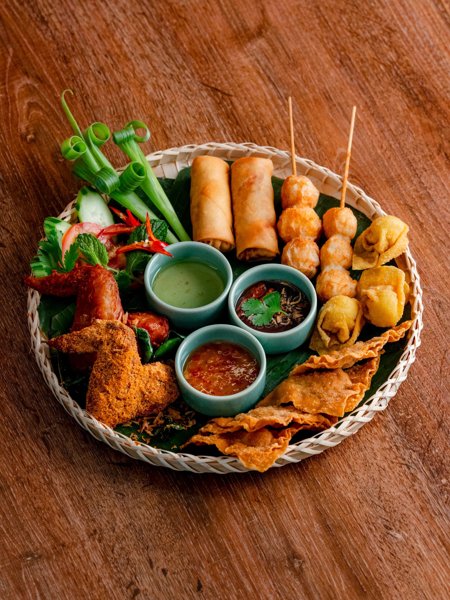 Assorted Thai appetizers platter with dipping sauces
