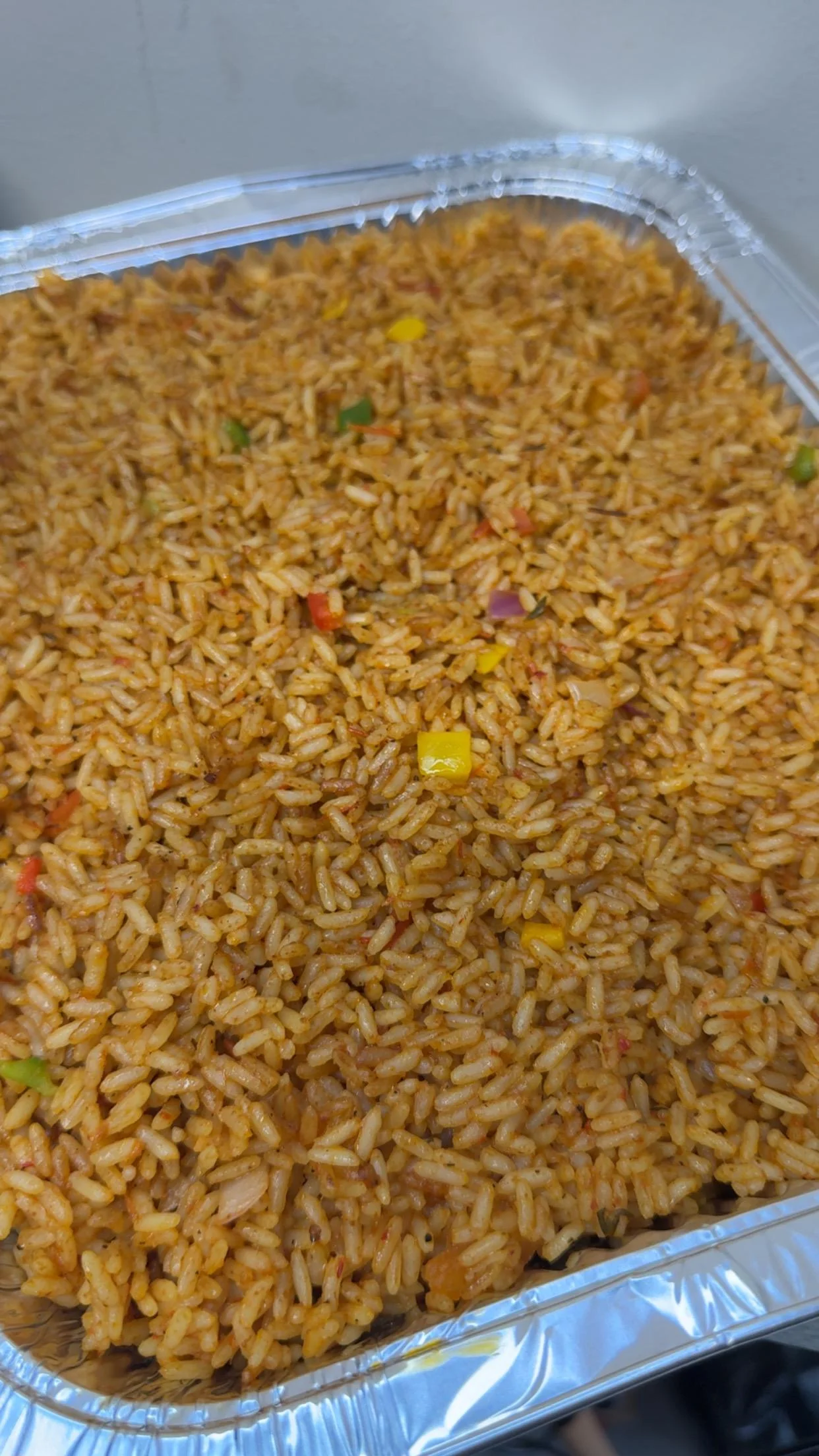 Nigerian jollof rice served in a tray