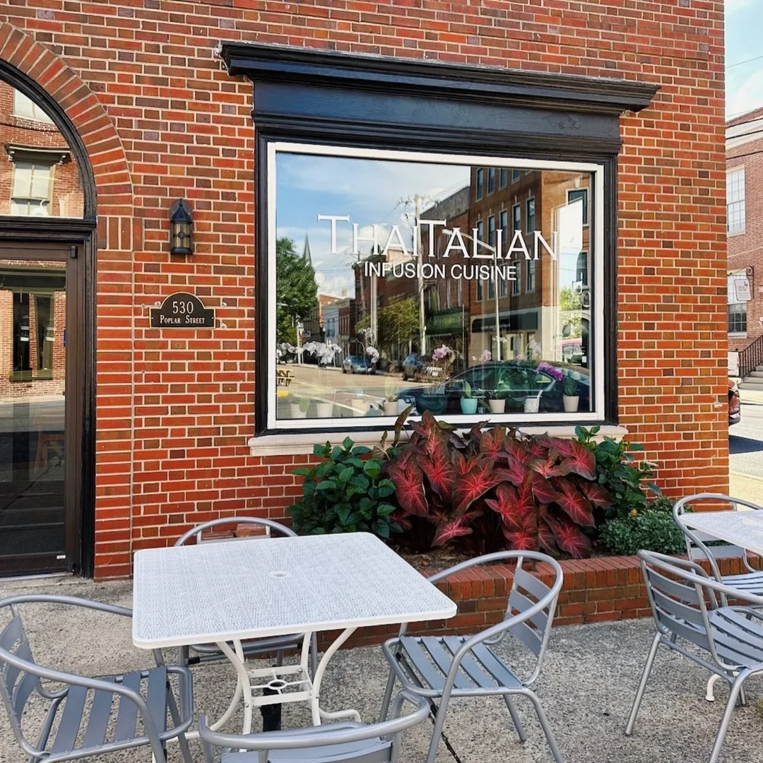 Exterior view of Thai-Italian fusion restaurant with outdoor seating